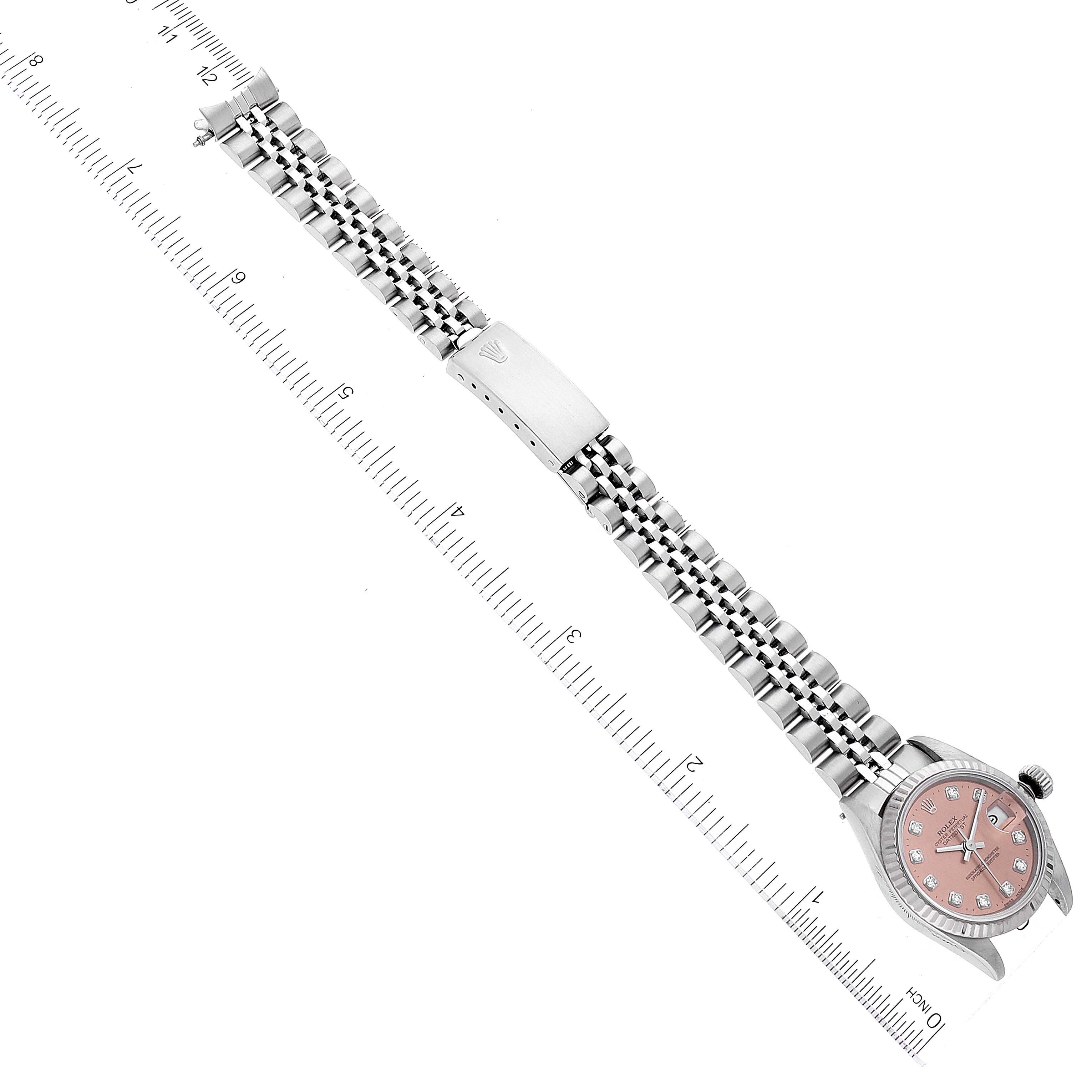 The image shows a top view of a Rolex Datejust 69174 Women's Stainless Steel Pink Dial 69174 Women's Stainless Steel Pink Dial watch, including the dial, case, and full bracelet with a clasp.