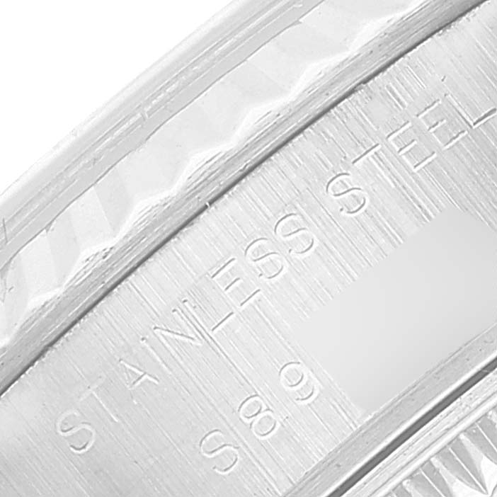 This image shows a close-up of the stainless steel edge and engraving on the Rolex Datejust 69174 Women's Stainless Steel Pink Dial 69174 Women's Stainless Steel Pink Dial watch.