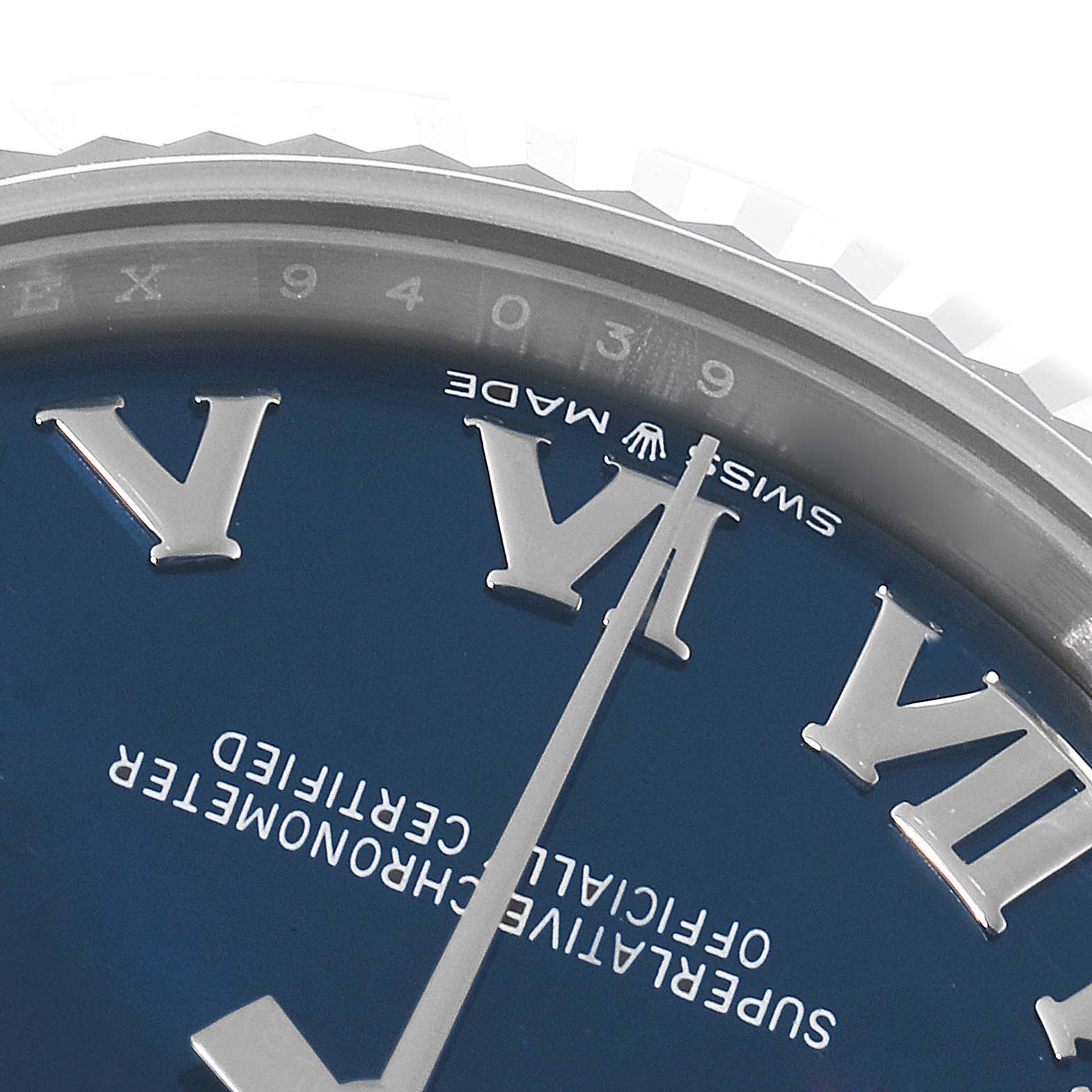 This close-up image shows the dial, Roman numerals, and part of the bezel of a Rolex Mid-Size 278274 Women's Stainless Steel Blue Dial 278274 Women's Stainless Steel Blue Dial watch.