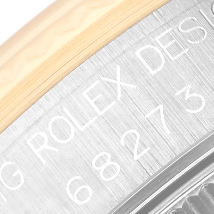 The image displays an engraved side view of the back casing of a Rolex Mid-Size 68273 Women's Steel and Gold (two tone) Black Dial 68273 Women's Steel and Gold (two tone) Black Dial model watch with partial text visible.