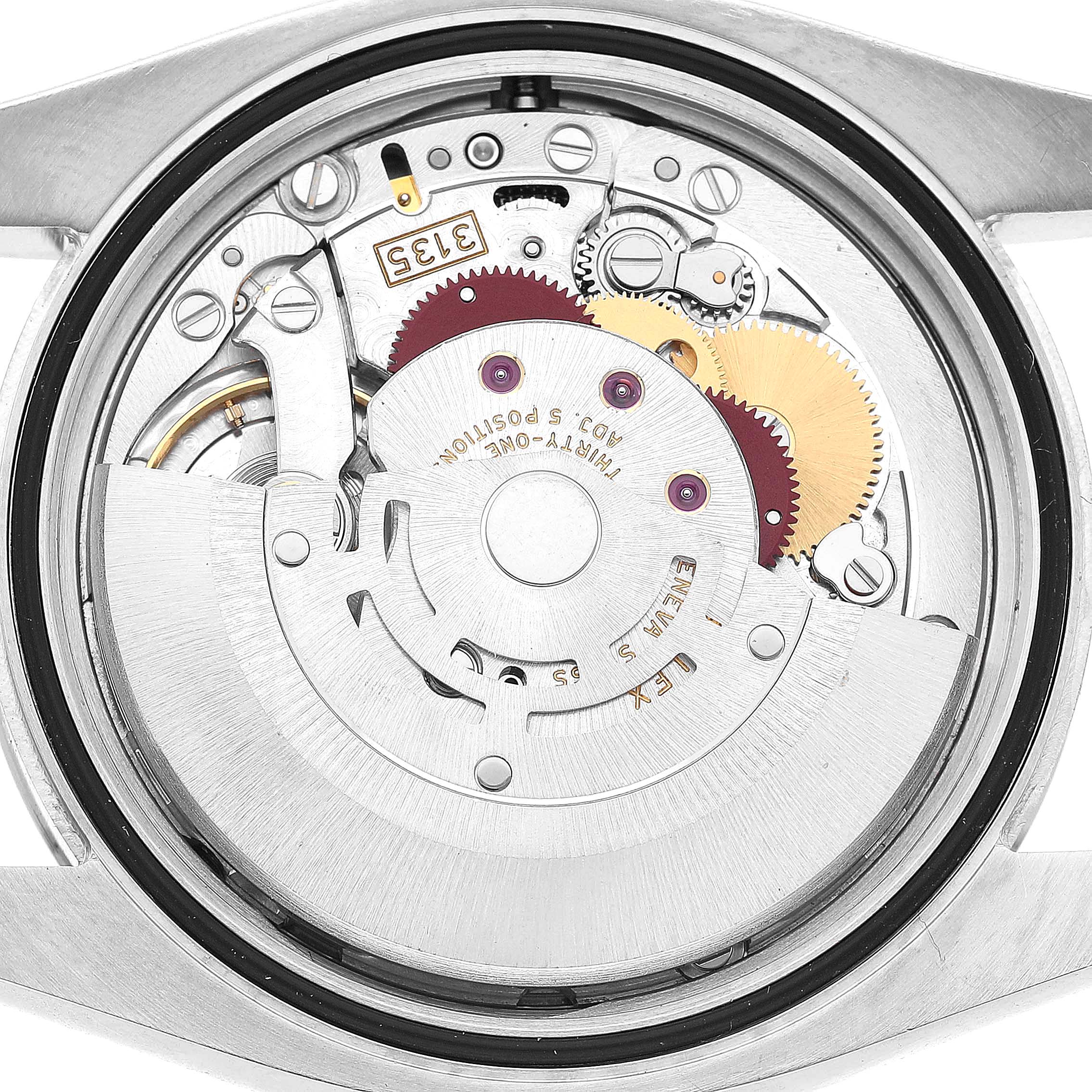 The image shows the movement of a Rolex Datejust 116200 Men's Stainless Steel Silver Dial watch from a back angle, highlighting gears and mechanism components.