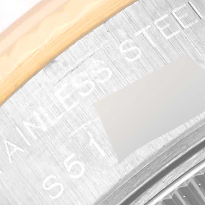 The image shows a close-up angle of the case side of a Rolex Datejust 69173 Women's Steel and Gold (two tone) Grey Dial 69173 Women's Steel and Gold (two tone) Grey Dial watch, highlighting the "Stainless Steel" engraving.
