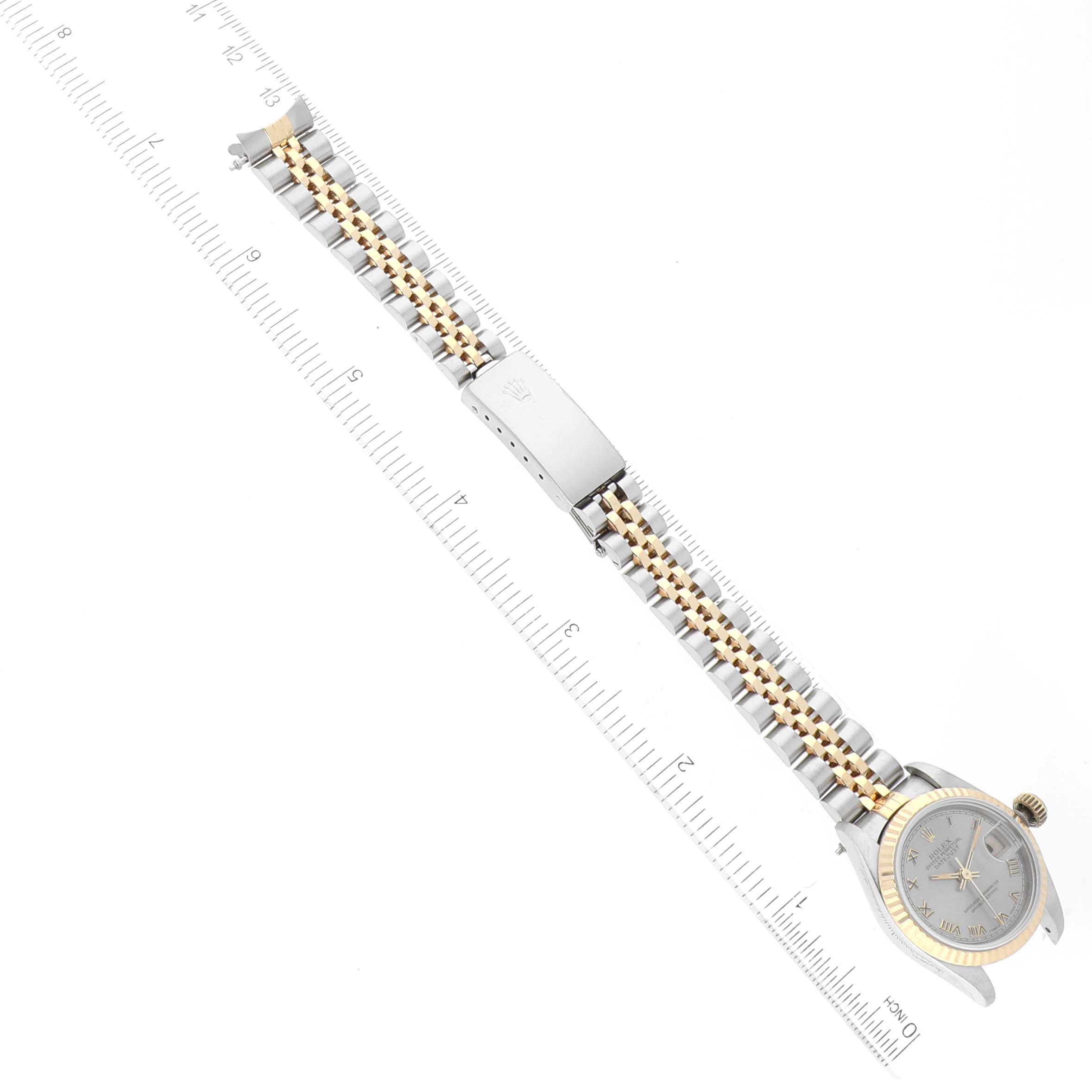 The image shows a Rolex Datejust 69173 Women's Steel and Gold (two tone) Grey Dial 69173 Women's Steel and Gold (two tone) Grey Dial watch laid flat, displaying the face, bezel, and bracelet with a ruler for scale.