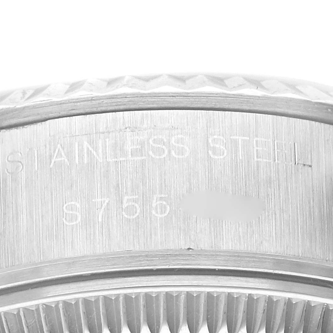This image shows a close-up of the side of the bezel and casing, displaying serial numbers on the Rolex Datejust 69174 Women's Stainless Steel Blue Dial 69174 Women's Stainless Steel Blue Dial watch.