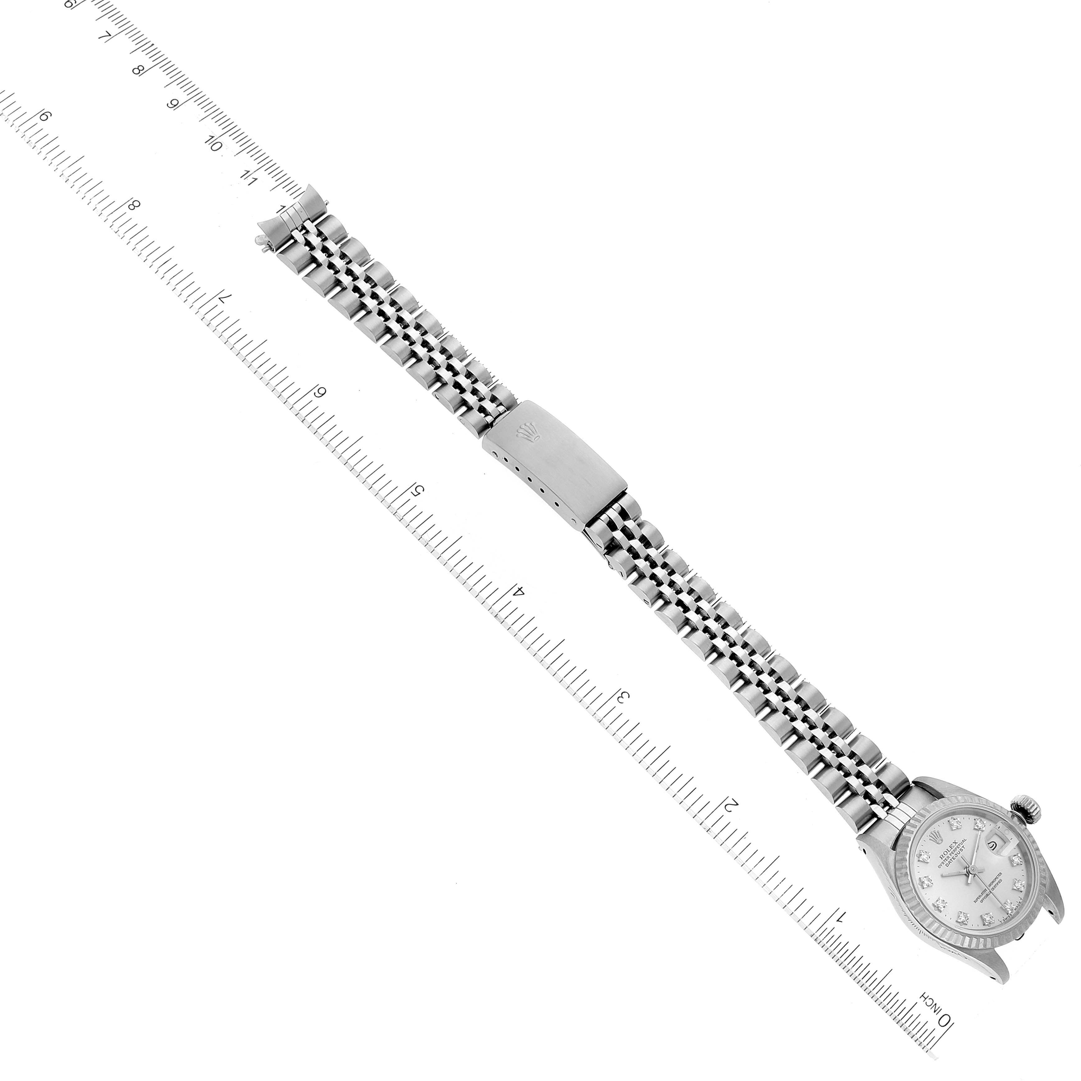 The image shows a Rolex Datejust 69174 Women's Stainless Steel Silver Dial 69174 Women's Stainless Steel Silver Dial watch and its full bracelet viewed from above, along with a ruler for measurement.