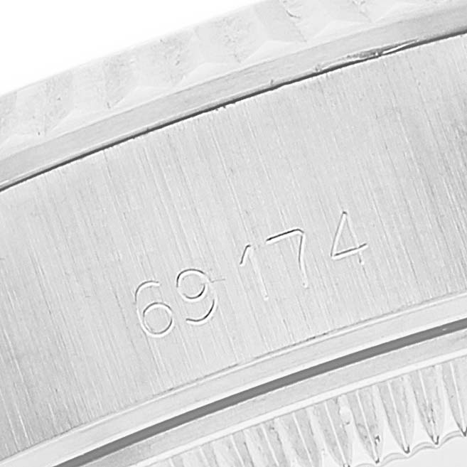This image shows a close-up of a Rolex Datejust 69174 Women's Stainless Steel Silver Dial 69174 Women's Stainless Steel Silver Dial casing with the model number "69174" engraved on it.