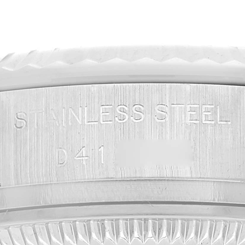 Close-up of the side of a Rolex Datejust 179174 Women's Stainless Steel White Dial 179174 Women's Stainless Steel White Dial showing the "Stainless Steel" engraving.