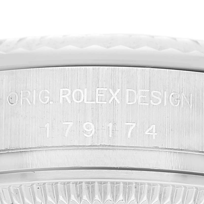 This close-up image shows the engraved reference number and design details on the case of a Rolex Datejust 179174 Women's Stainless Steel White Dial 179174 Women's Stainless Steel White Dial watch.