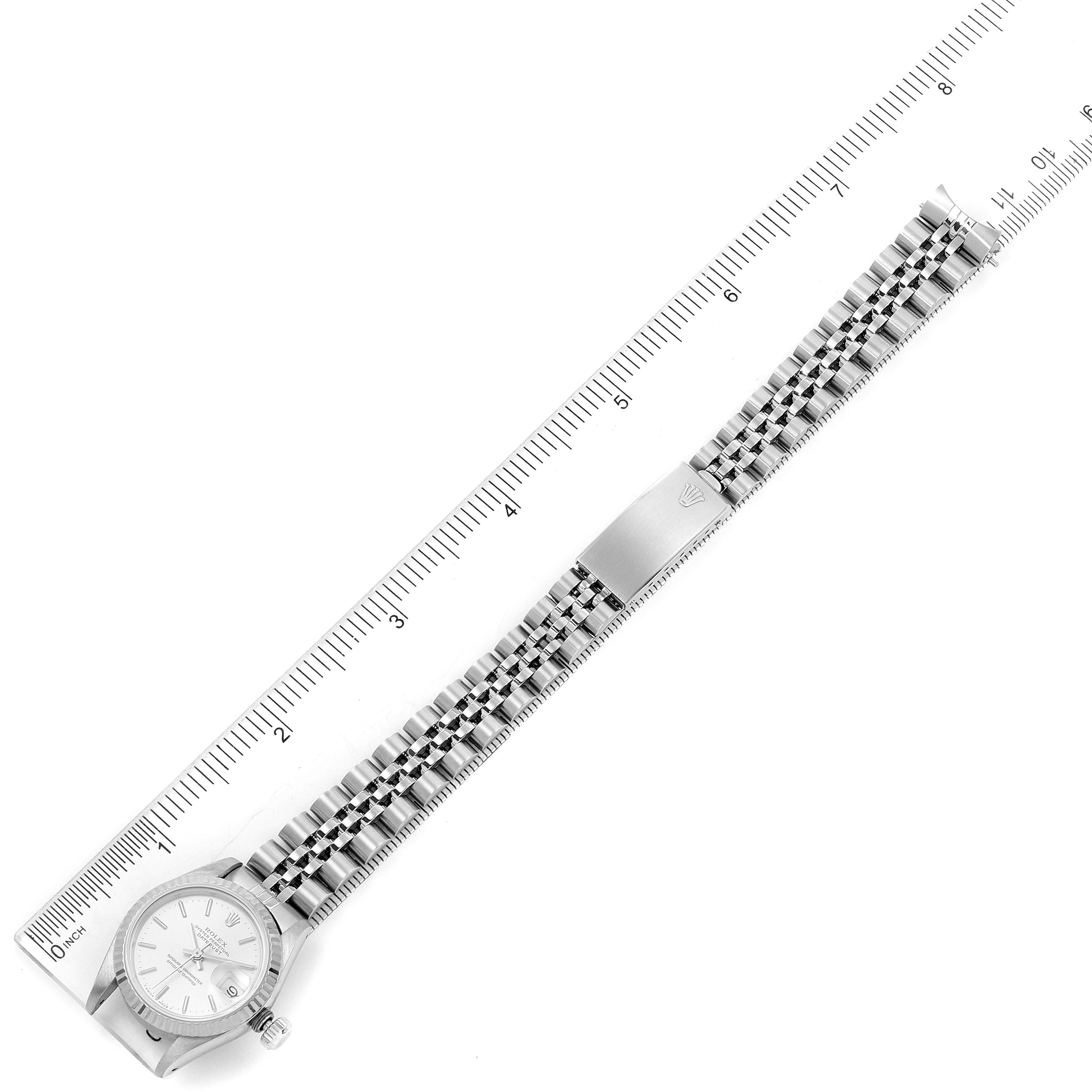 The image shows a top-down view of a Rolex Datejust 69174 Women's Stainless Steel Silver Dial 69174 Women's Stainless Steel Silver Dial watch, displaying the full bracelet alongside a ruler for length measurement.