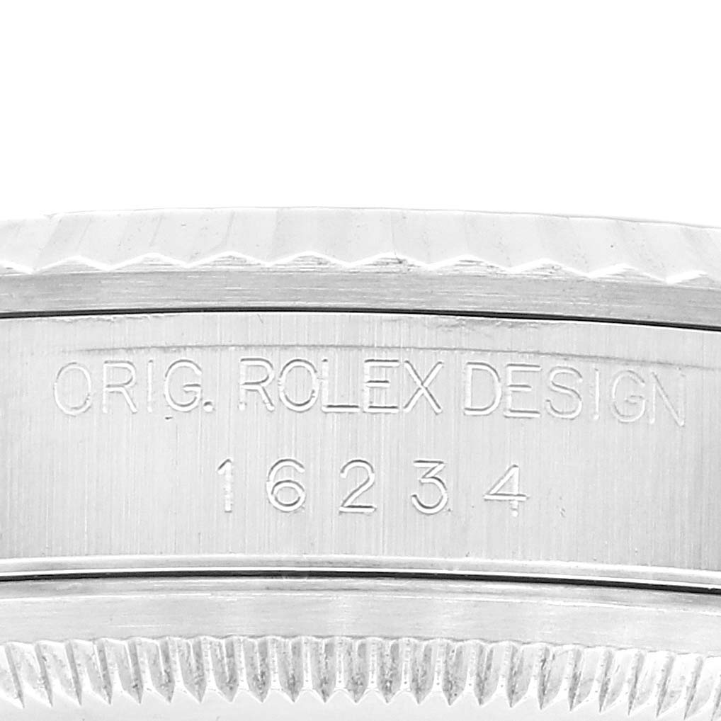 This image shows a close-up of the side of a Rolex Datejust 16234 Men's Stainless Steel Silver Dial 16234 Men's Stainless Steel Silver Dial watch, focusing on the engraved model number and design details.