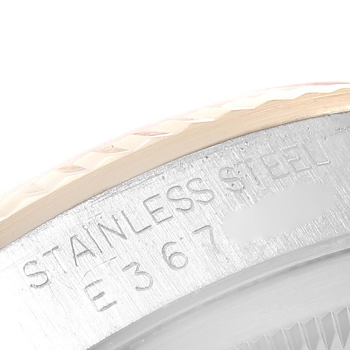 This close-up image shows part of the stainless steel case and bezel of a Rolex Datejust 16233 Men's Steel and Gold (two tone) Champagne Dial 16233 Men's Steel and Gold (two tone) Champagne Dial watch.