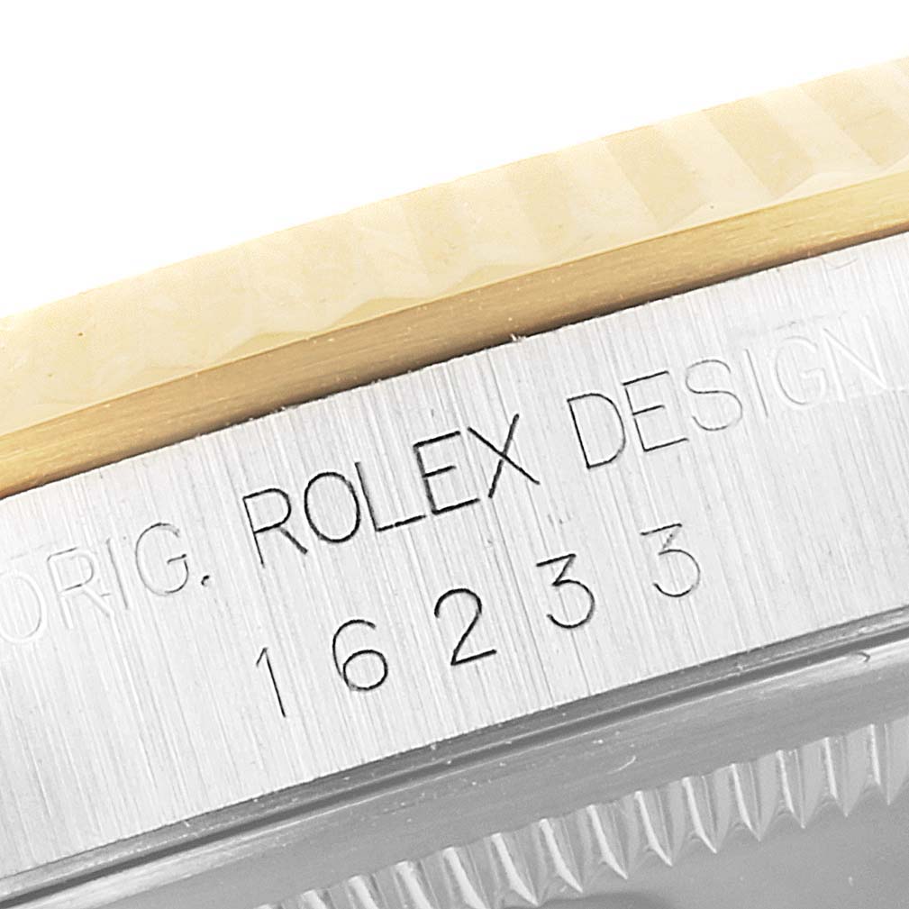 Close-up of the case side of a Rolex Datejust 16233 Men's Steel and Gold (two tone) White Dial 16233 Men's Steel and Gold (two tone) White Dial, showing the model number "16233" and part of the bezel.