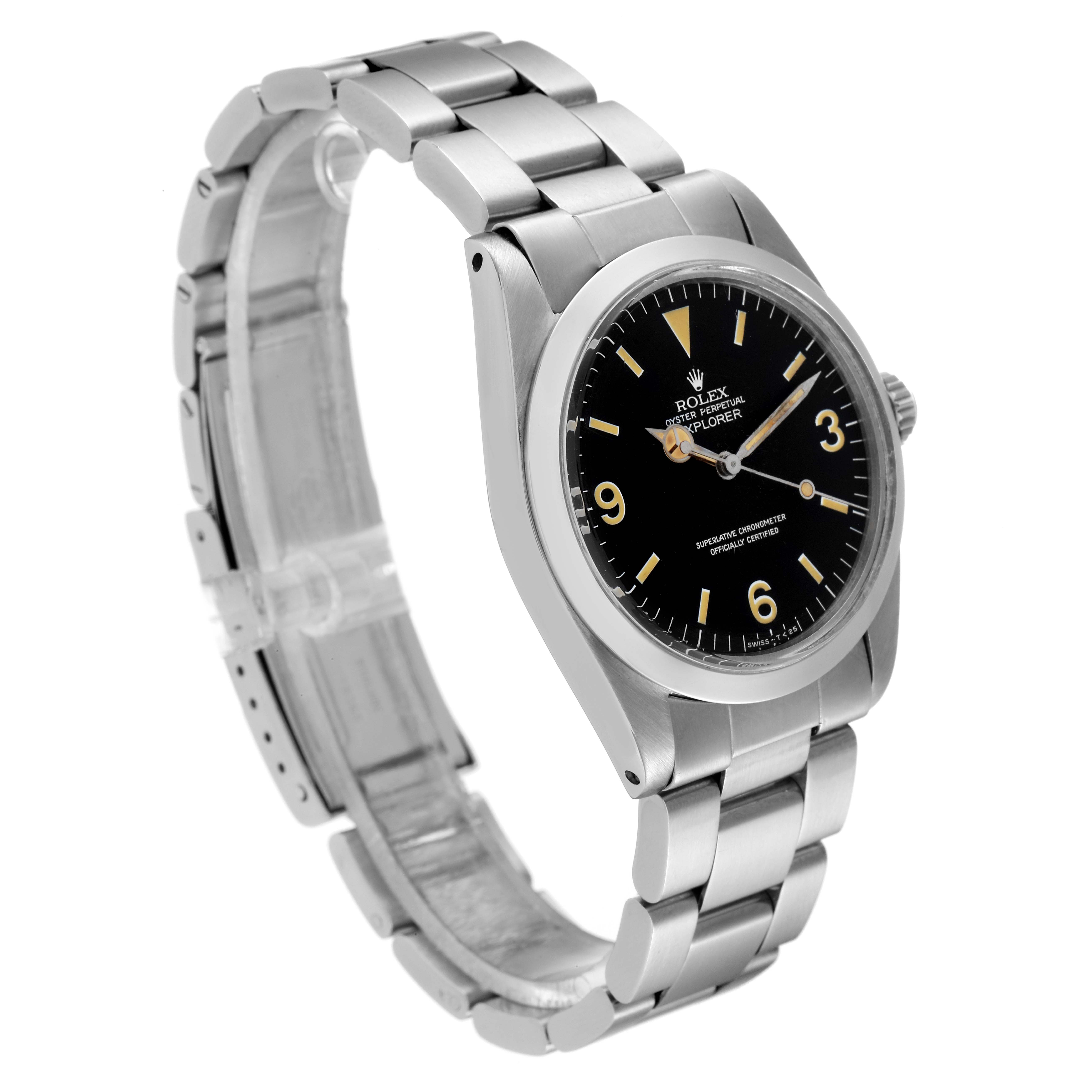 The image shows the front and side angle of a Vintage Collection Rolex watch with its metal strap and black dial visible.