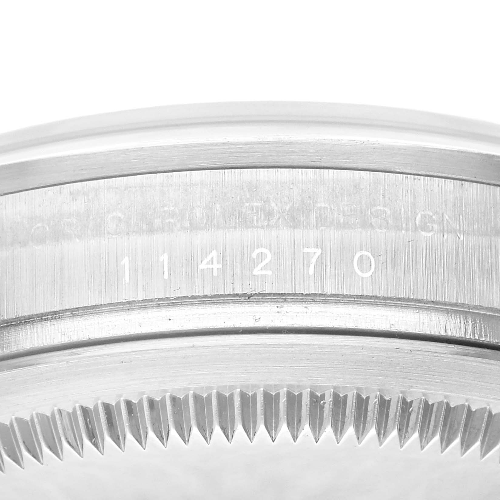 This image shows a close-up of the model number and serrated edge of the bezel on a Rolex Explorer 114270 Men
s Stainless Steel Black Dial 114270 Men
s Stainless Steel Black Dial watch.