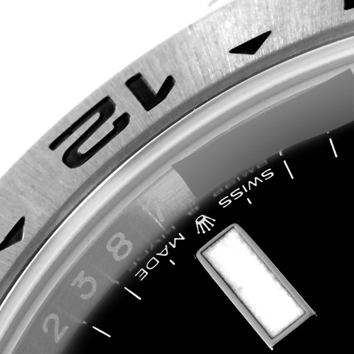 The image shows a close-up of the bezel and a portion of the dial with markers on a Rolex Explorer 226570 Men
s Stainless Steel Black Dial 226570 Men
s Stainless Steel Black Dial watch.