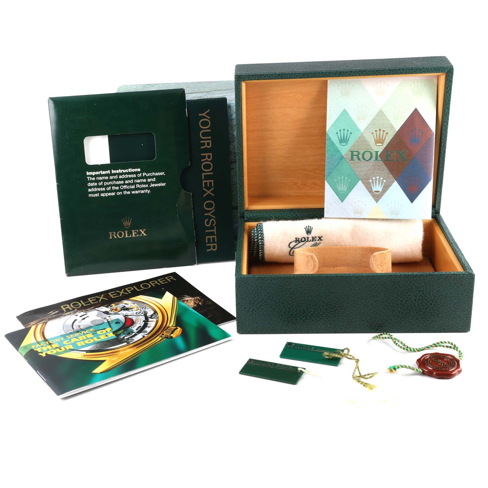 The image shows the packaging, booklets, tags, and accessories for a Rolex Explorer 16570 Men's Stainless Steel Black Dial 16570 Men's Stainless Steel Black Dial watch.