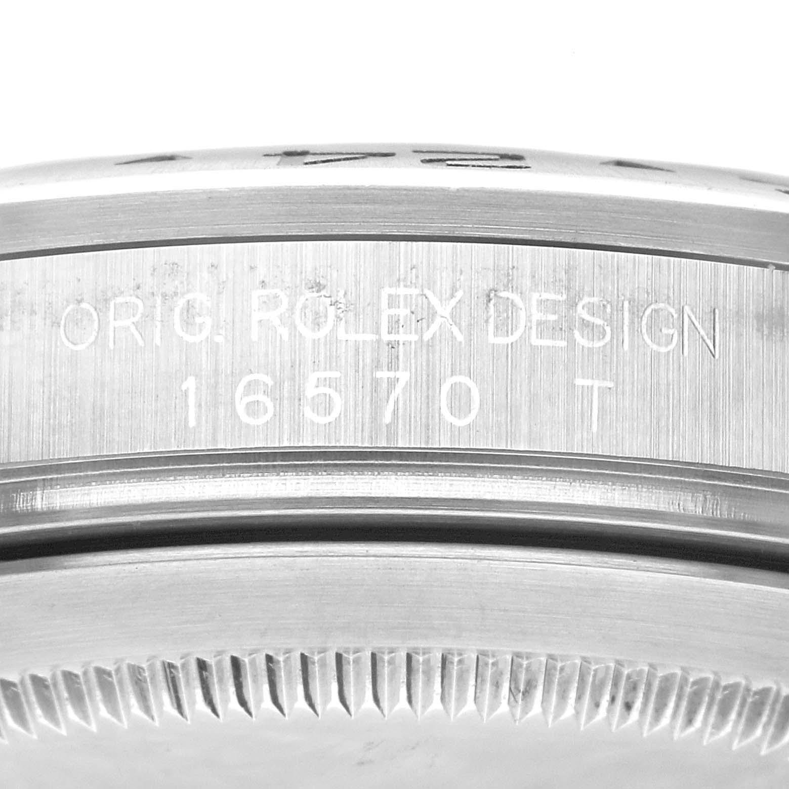 The image shows a close-up view of the case side of a Rolex Explorer 16570 Men's Stainless Steel Black Dial 16570 Men's Stainless Steel Black Dial model 16570, featuring the engraving "ORIG. ROLEX DESIGN."