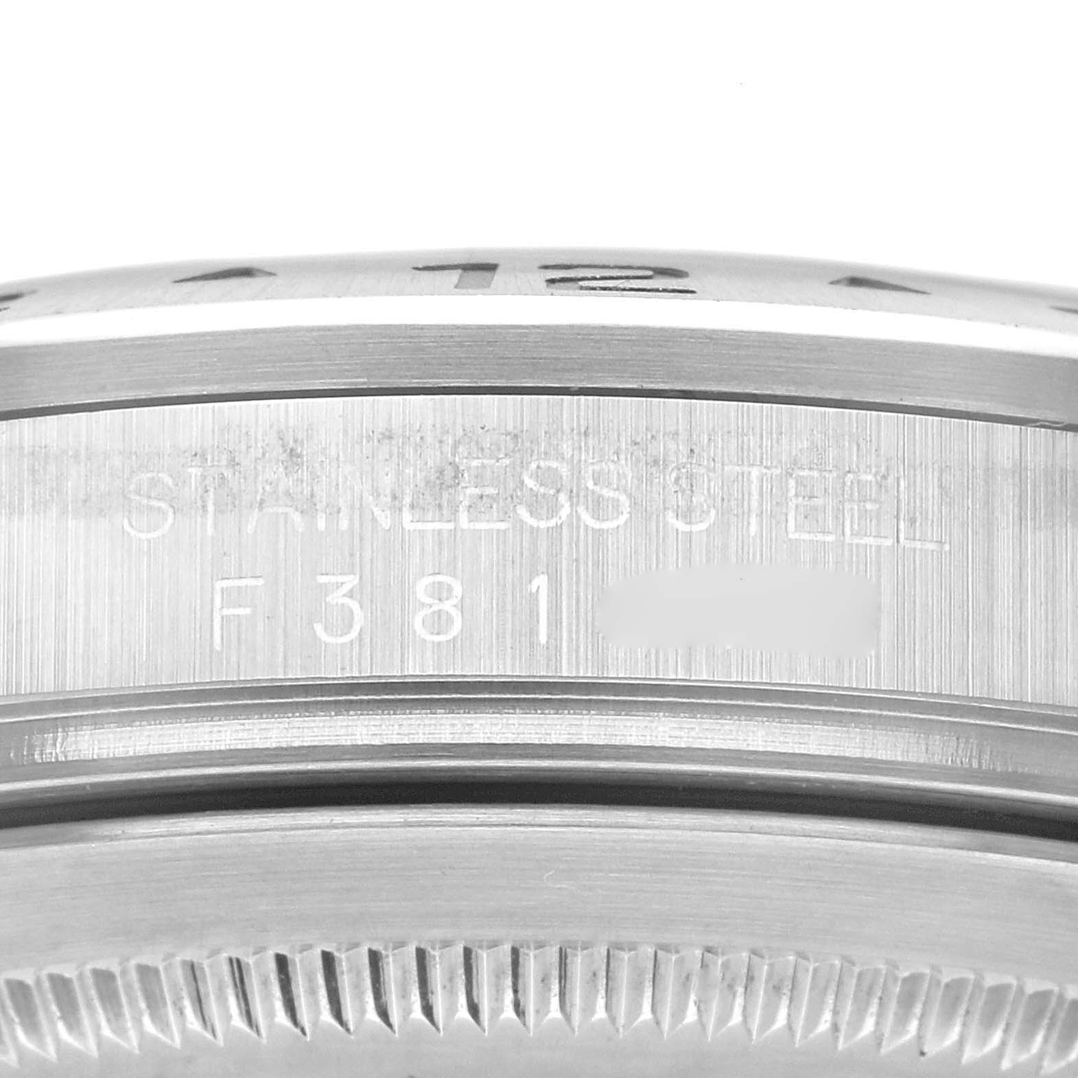 This image shows a close-up of the side engraving on the bezel and case of a Rolex Explorer 16570 Men's Stainless Steel Black Dial 16570 Men's Stainless Steel Black Dial watch.