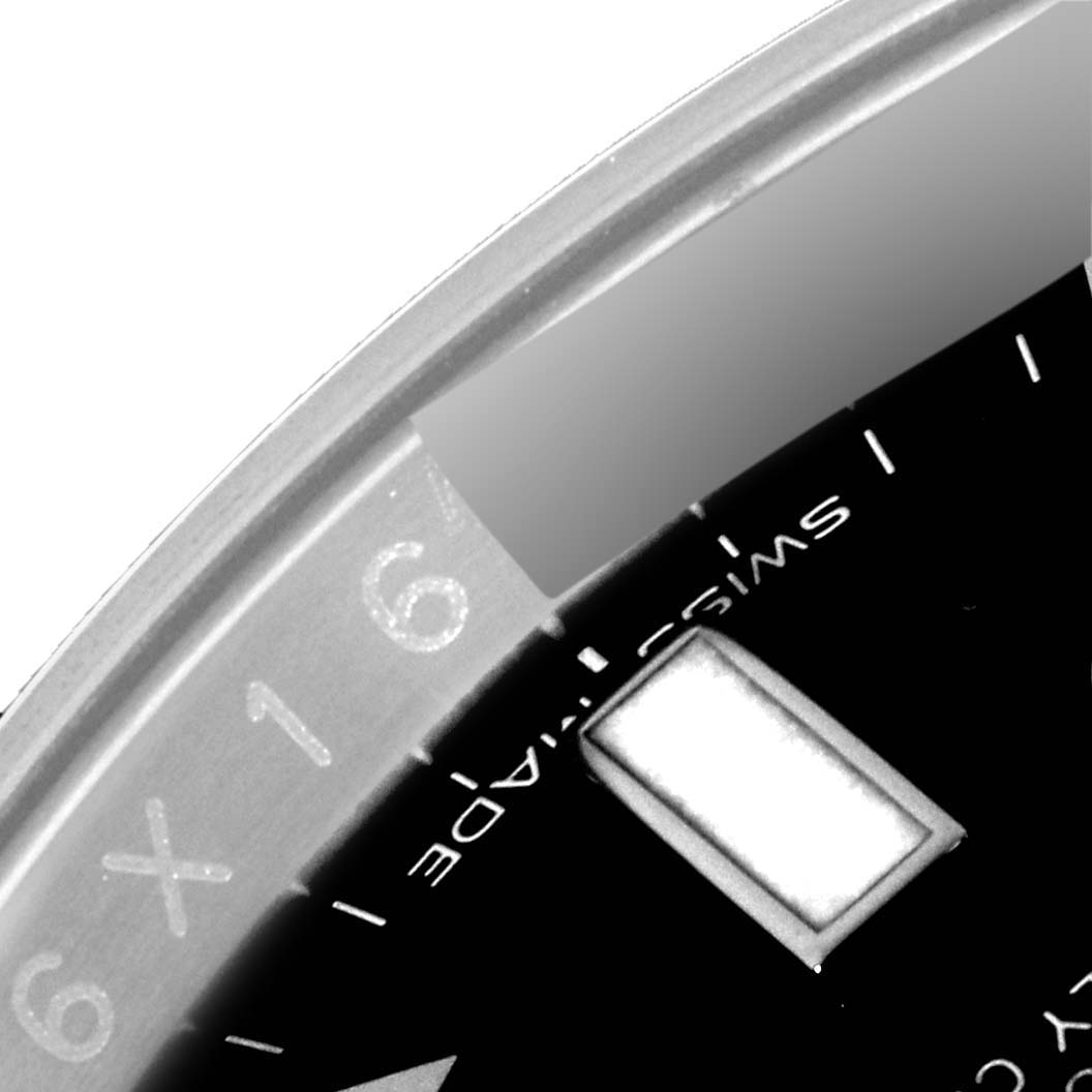 The image shows a close-up of the bezel and part of the dial of a Rolex GMT-Master 116710LN Men
s Stainless Steel Black Dial 116710LN Men
s Stainless Steel Black Dial watch.