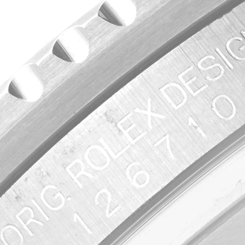 The image shows a close-up of the engraved bezel and internal ring of a Rolex GMT-Master 126710BLRO Men's Stainless Steel Black Dial 126710BLRO Men's Stainless Steel Black Dial watch.