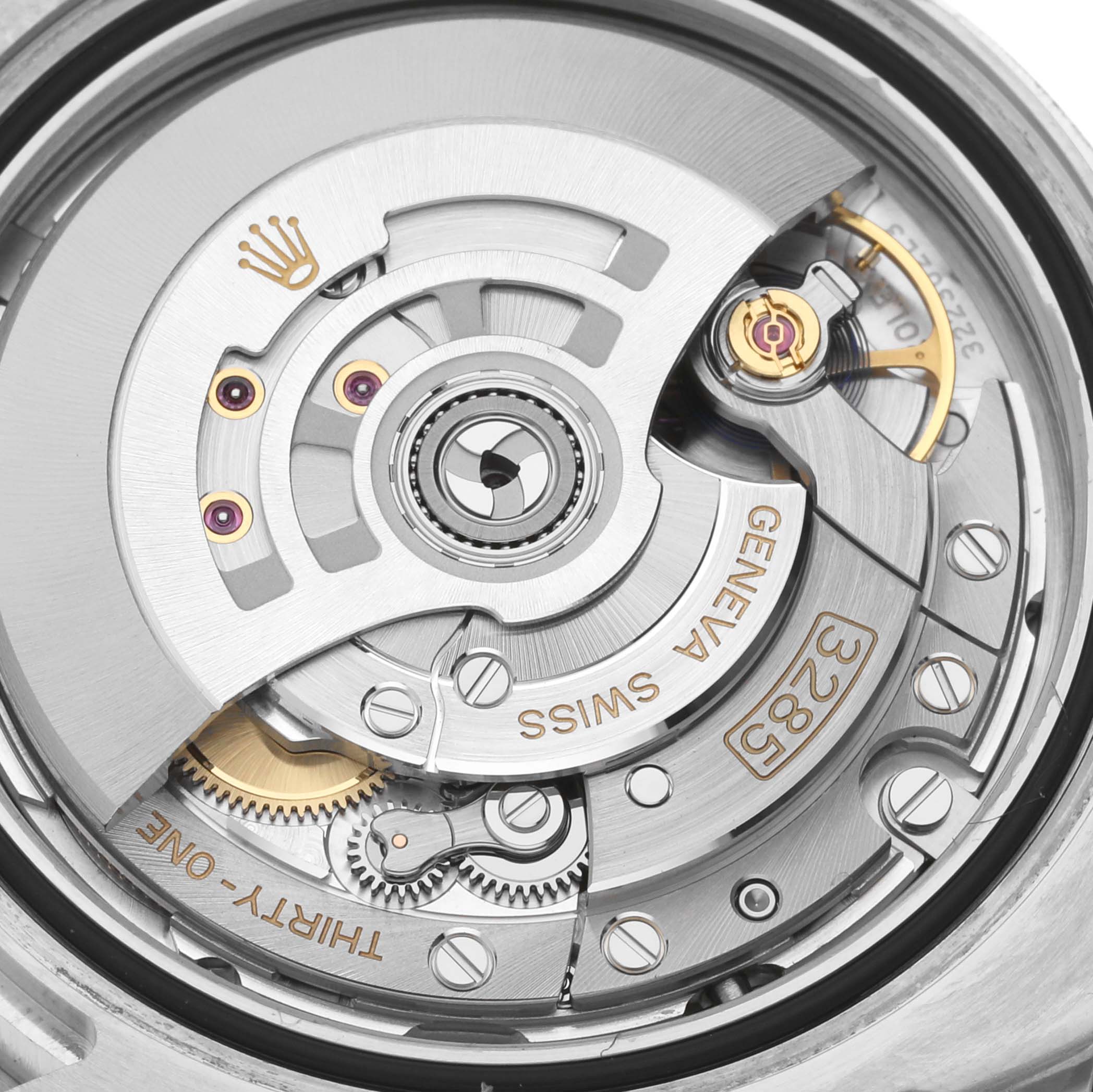 This image shows the intricate inner mechanism of a Rolex GMT-Master 126710BLRO Men's Stainless Steel Black Dial 126710BLRO Men's Stainless Steel Black Dial watch, focusing on the movement and gears.