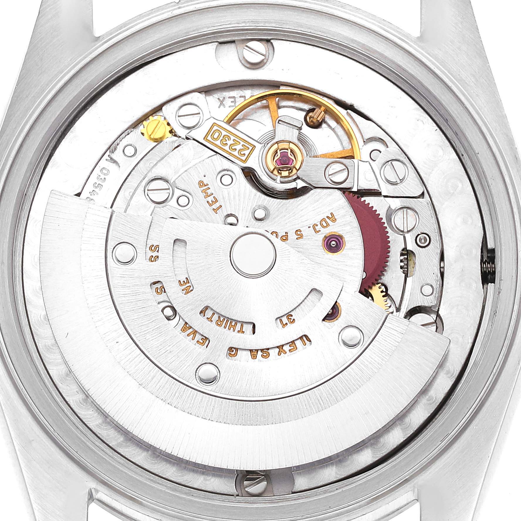 The image shows an inside view of the movement mechanism of a Mid-Size Rolex watch, highlighting the intricate components and inner workings.