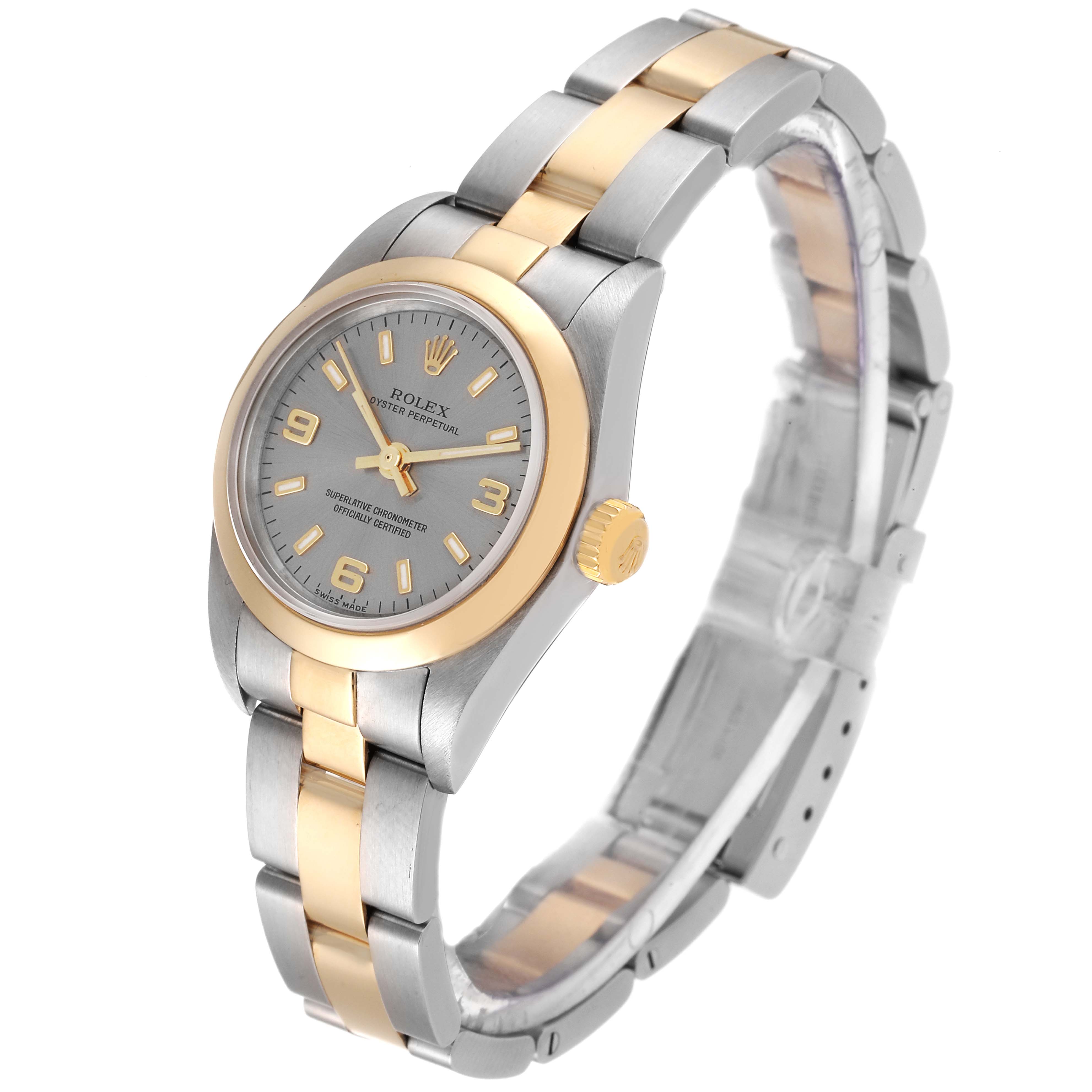 The image shows a side-angle view of a Rolex Oyster Perpetual 76183 Women's Steel and Gold (two tone) Grey Dial 76183 Women's Steel and Gold (two tone) Grey Dial watch, featuring its two-tone bracelet, dial, and crown.