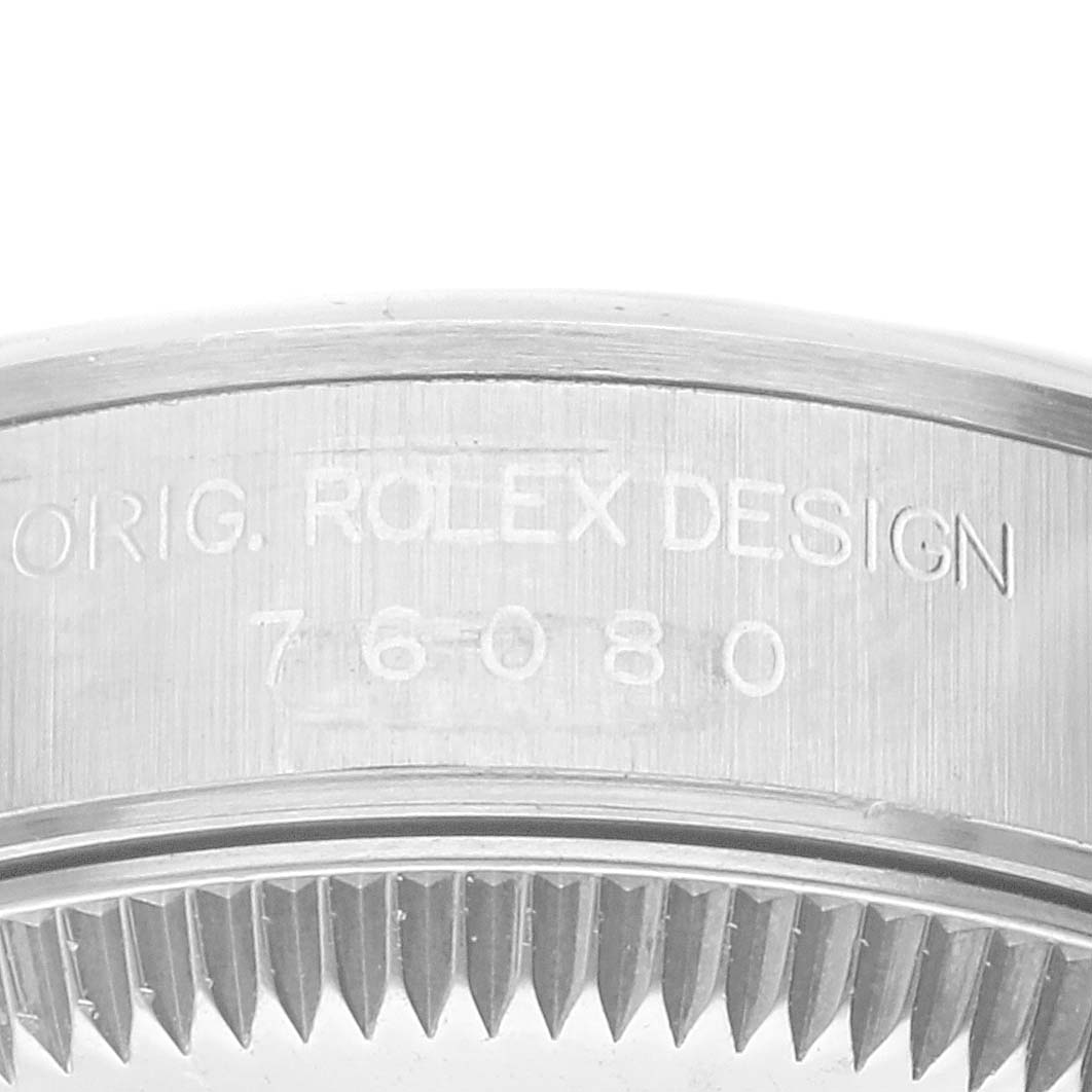 This is a close-up of the case side and rear bezel of a Rolex Oyster Perpetual 76080 Women
s Stainless Steel Pink Dial 76080 Women
s Stainless Steel Pink Dial watch, showing its design number.