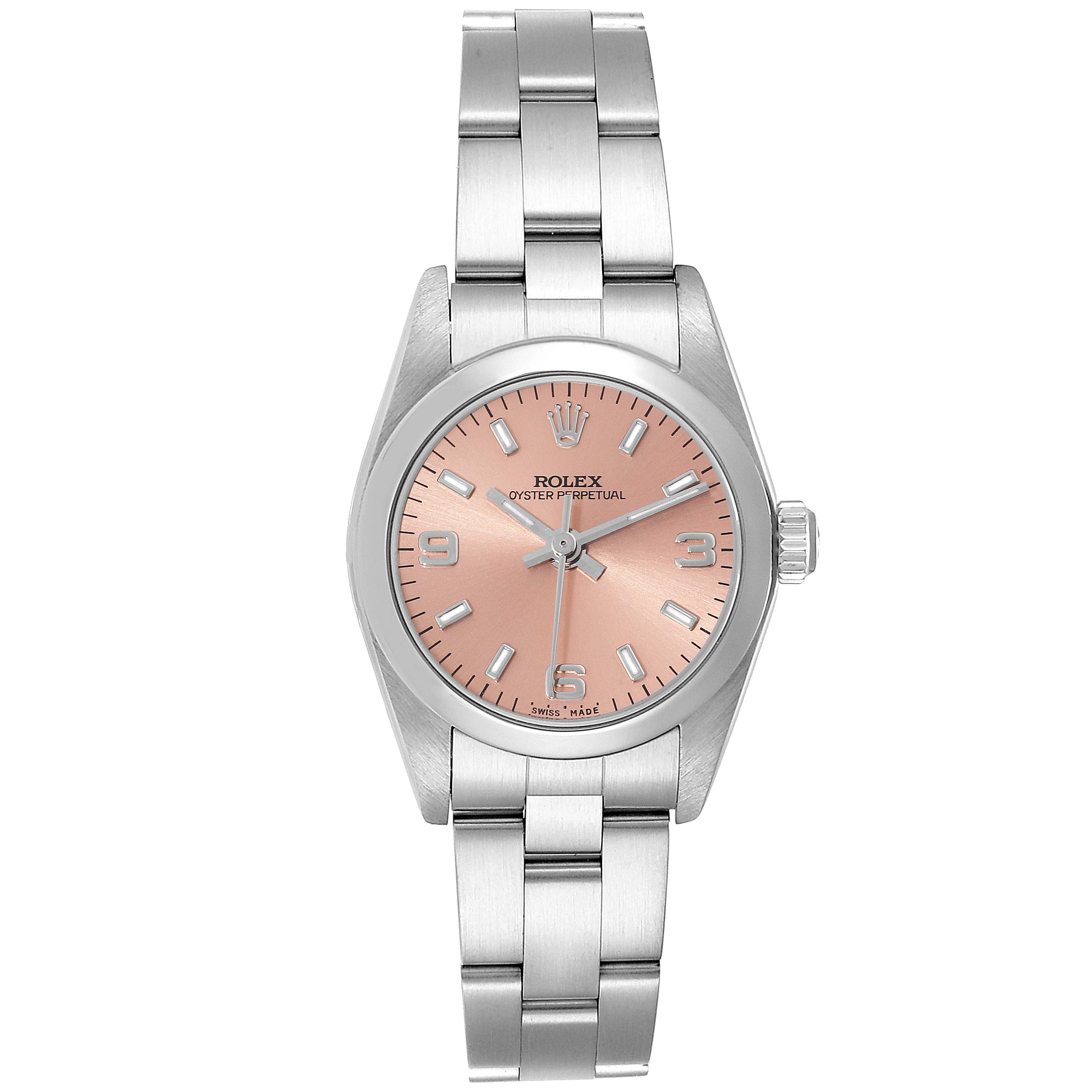 The image shows a front view of a Rolex Oyster Perpetual 76080 Women
s Stainless Steel Pink Dial 76080 Women
s Stainless Steel Pink Dial watch, highlighting its pink dial and stainless steel bracelet.