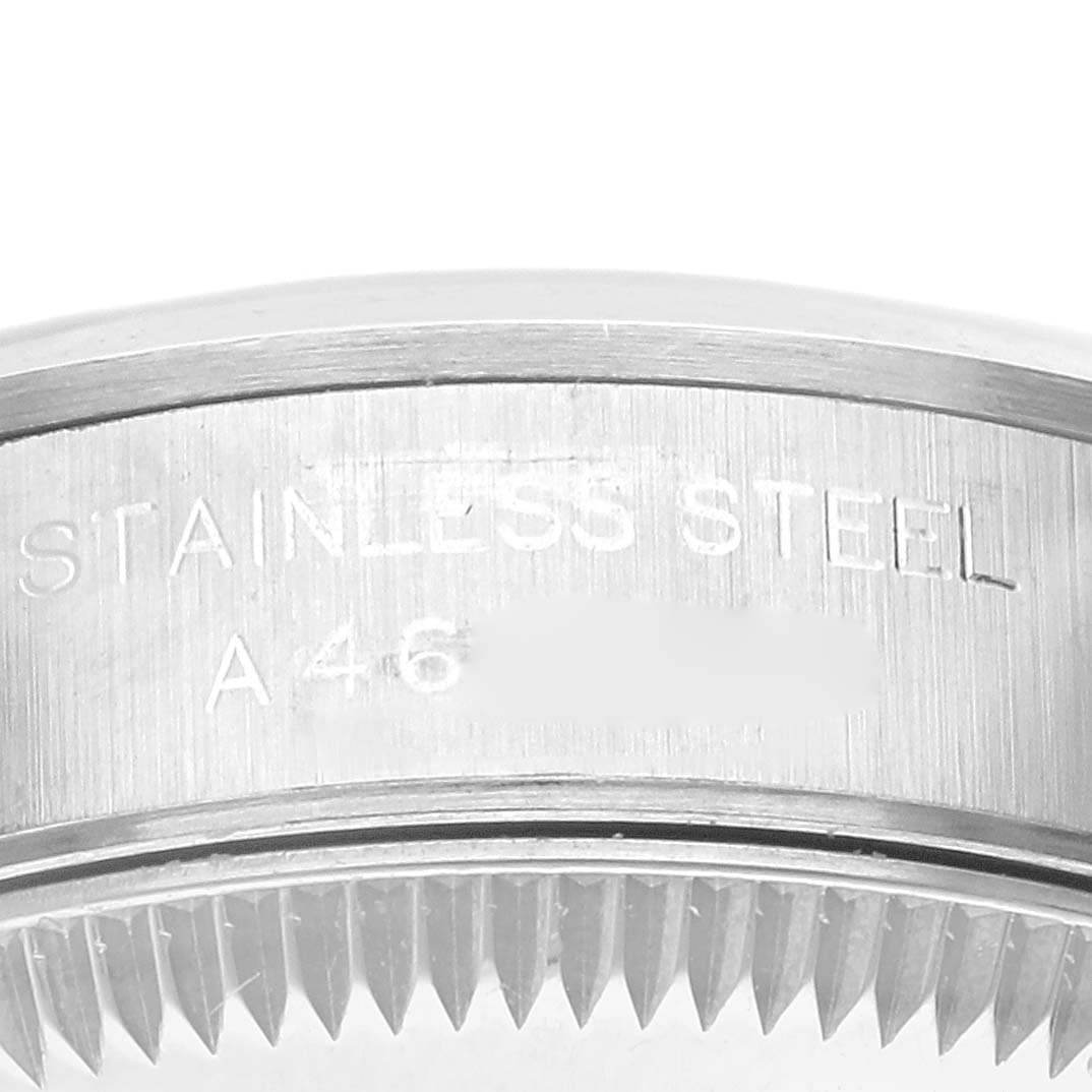 This image shows a close-up of the stainless steel case back of a Rolex Oyster Perpetual 76080 Women
s Stainless Steel Pink Dial 76080 Women
s Stainless Steel Pink Dial watch.