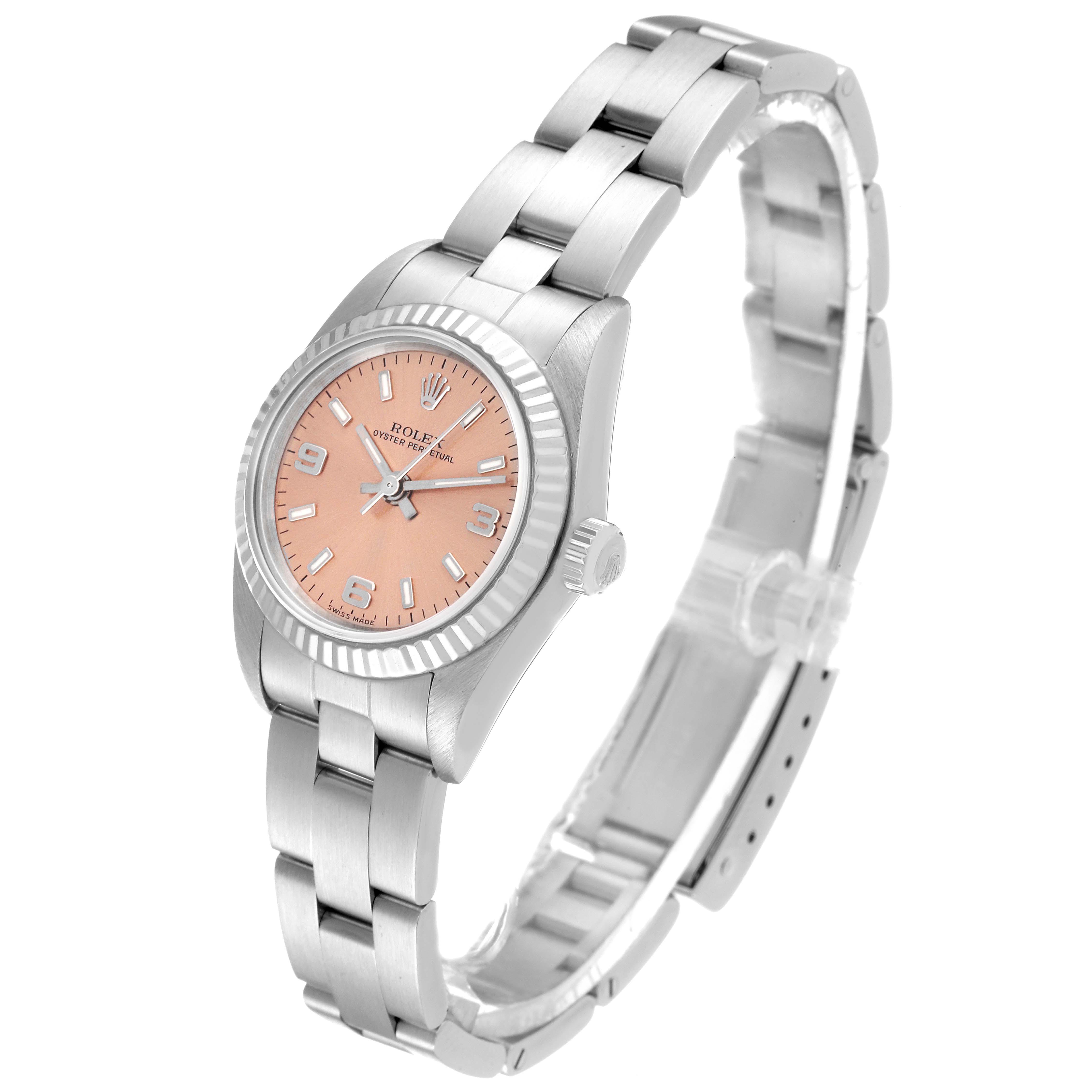 The image displays a side angle of the Rolex Oyster Perpetual 76094 Women
s Stainless Steel Pink Dial 76094 Women
s Stainless Steel Pink Dial watch, showcasing its dial, bezel, crown, and bracelet.