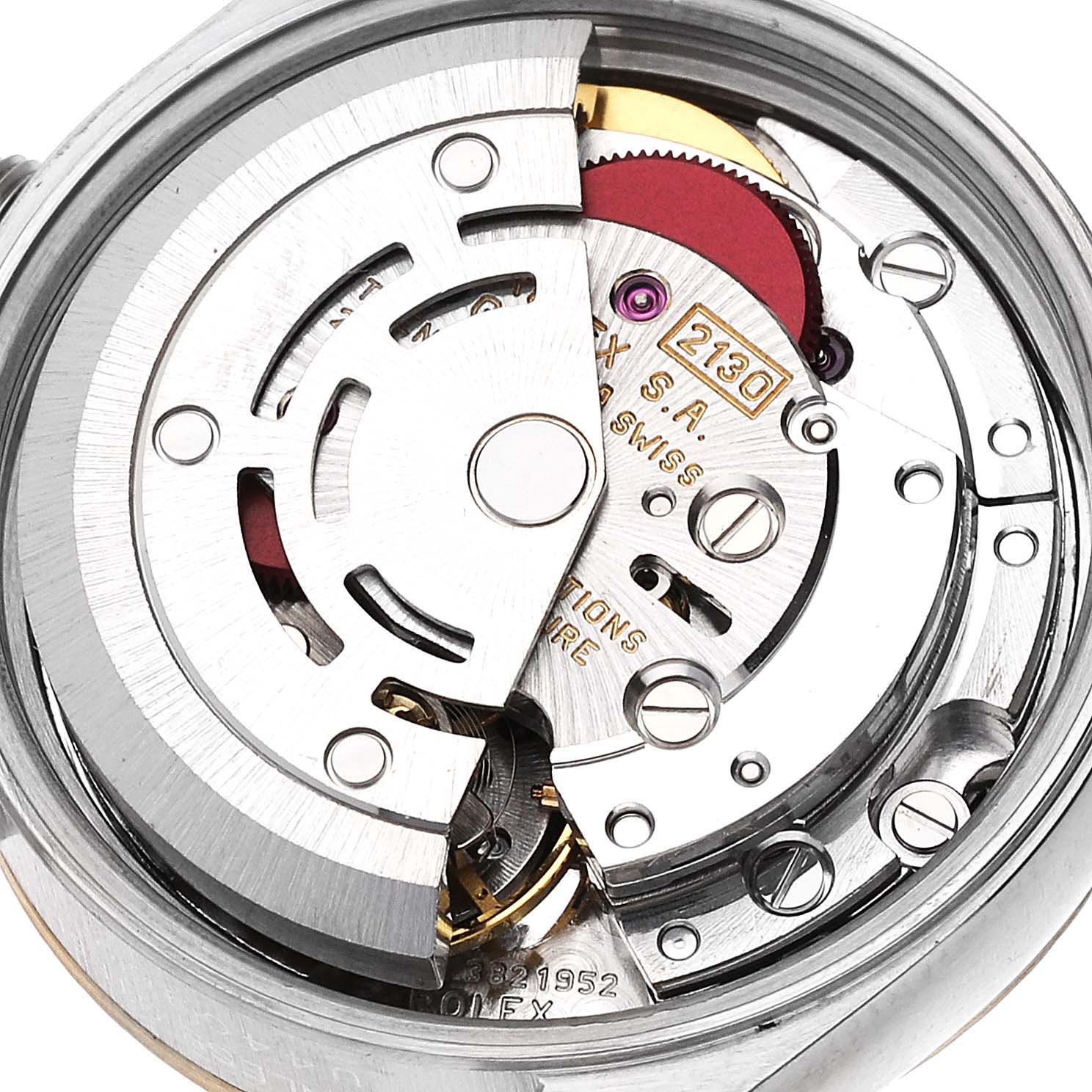 The image shows a close-up view of the movement mechanism of a Rolex Oyster Perpetual 67193 Women's Steel and Gold (two tone) Champagne Dial 67193 Women's Steel and Gold (two tone) Champagne Dial watch from the back.