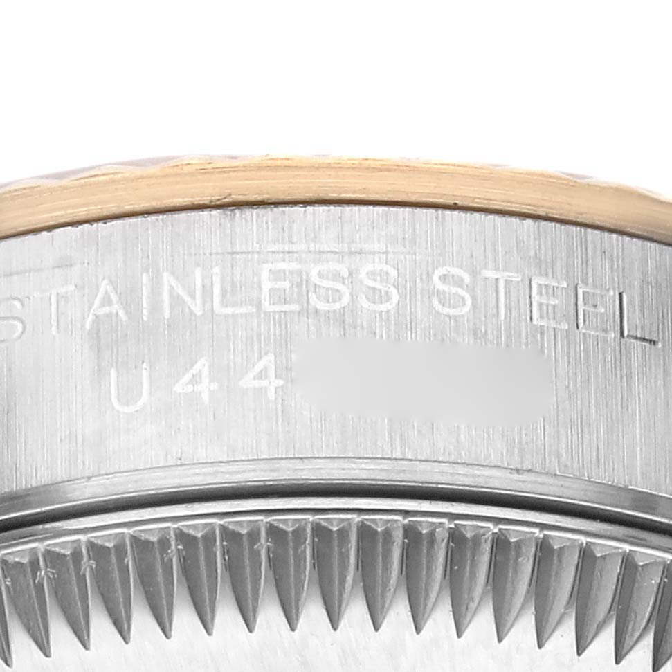 This close-up image showcases the Rolex Oyster Perpetual 67193 Women's Steel and Gold (two tone) Champagne Dial 67193 Women's Steel and Gold (two tone) Champagne Dial model's side, highlighting the stainless steel case and part of the bezel.