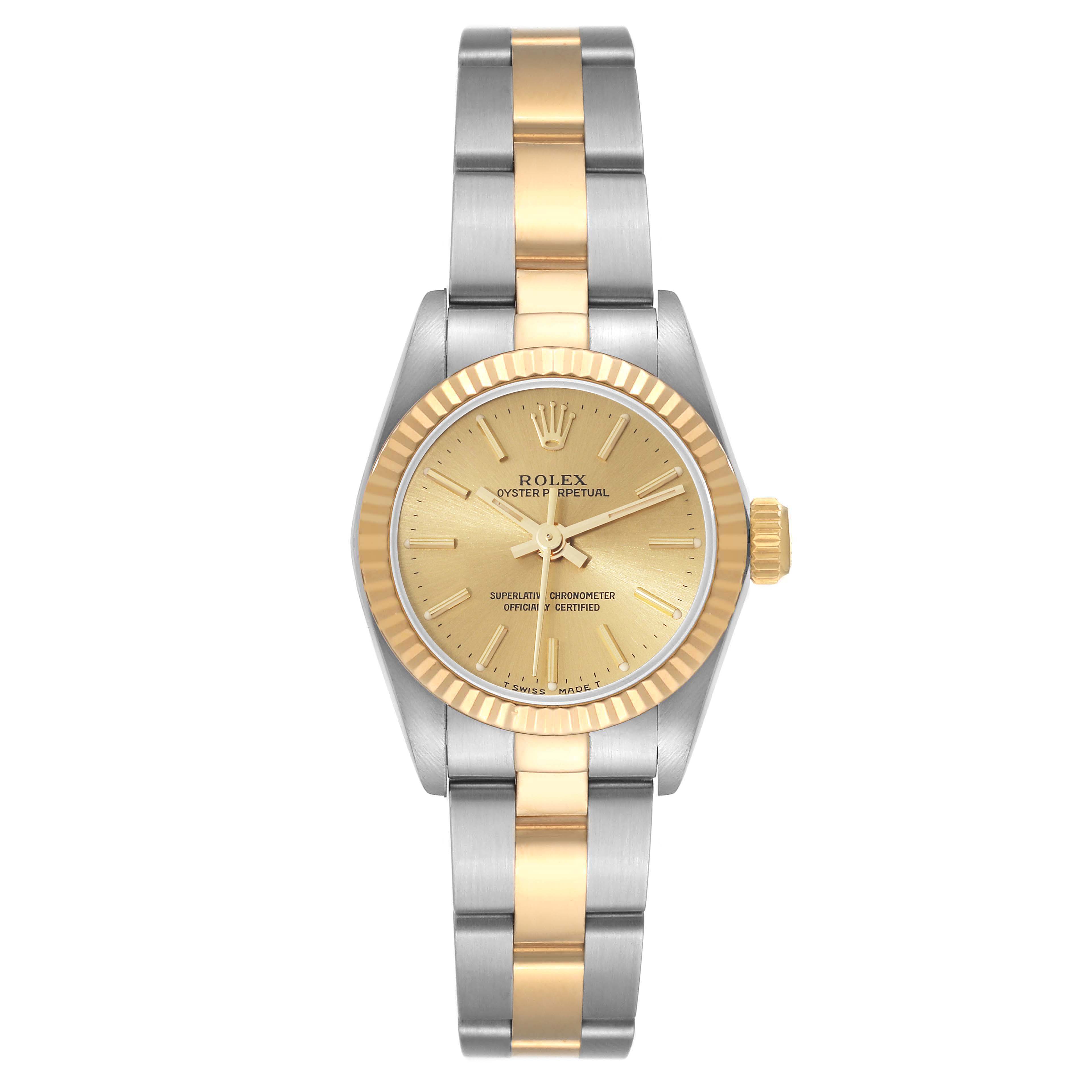 The image shows a front view of a Rolex Oyster Perpetual 67193 Women's Steel and Gold (two tone) Champagne Dial 67193 Women's Steel and Gold (two tone) Champagne Dial watch with a gold dial and a two-tone metal bracelet.