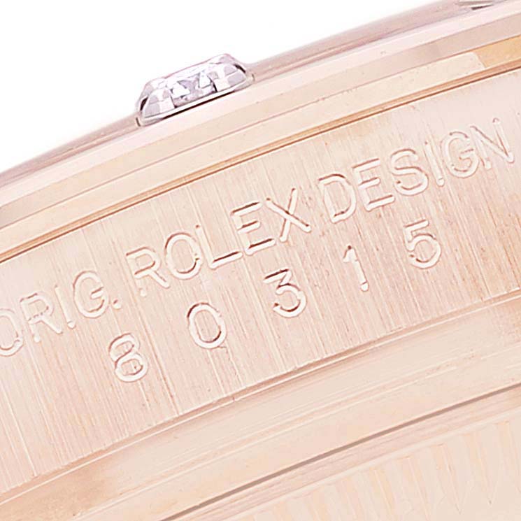 This close-up image shows the engraved bezel of the Rolex Pearlmaster 80315 Women's Rose Gold Mother of Pearl Dial 80315 Women's Rose Gold Mother of Pearl Dial watch.