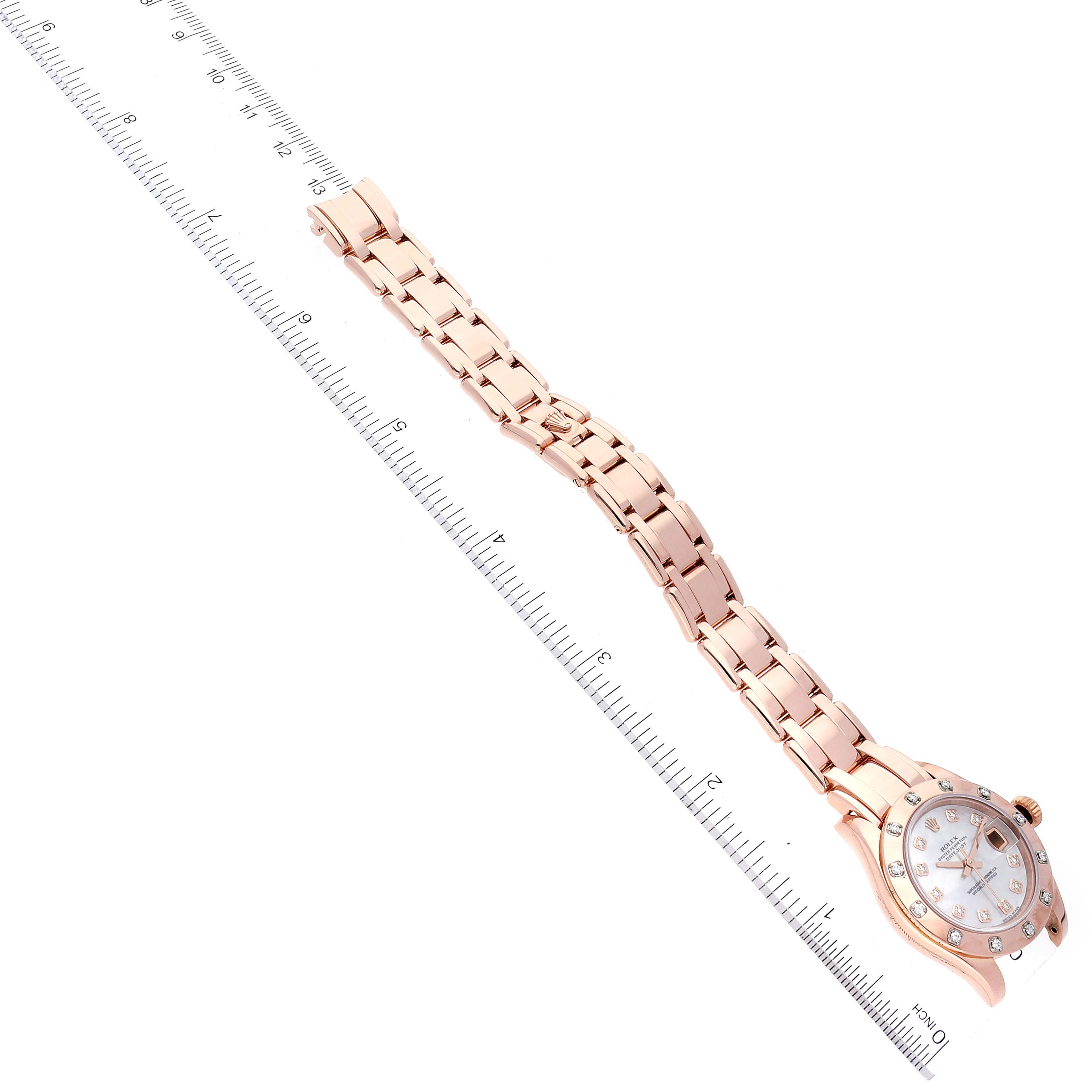 The image shows a top-down view of a Rolex Pearlmaster 80315 Women's Rose Gold Mother of Pearl Dial 80315 Women's Rose Gold Mother of Pearl Dial watch, including the face, bezel, and full bracelet, with a ruler for scale.