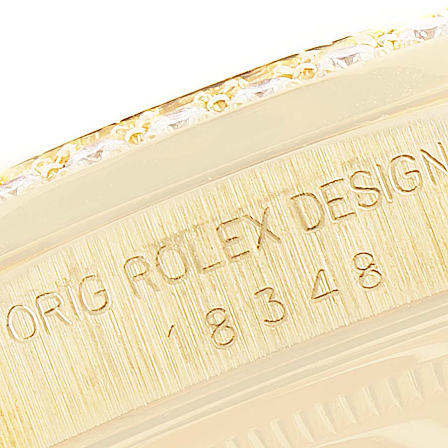 The image shows a close-up of the engraved case back of a Rolex President 18348 Men
s Yellow Gold Champagne Dial 18348 Men
s Yellow Gold Champagne Dial model watch.