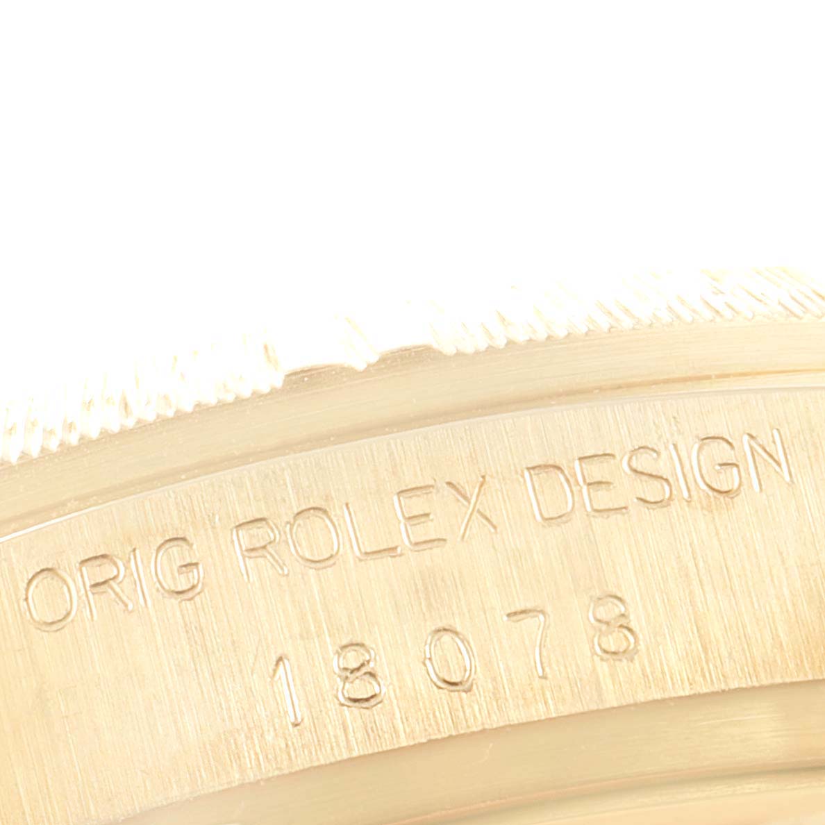 The image shows the serial engraving on the case back of a Rolex President 18078 Men's Yellow Gold Champagne Dial 18078 Men's Yellow Gold Champagne Dial model watch.