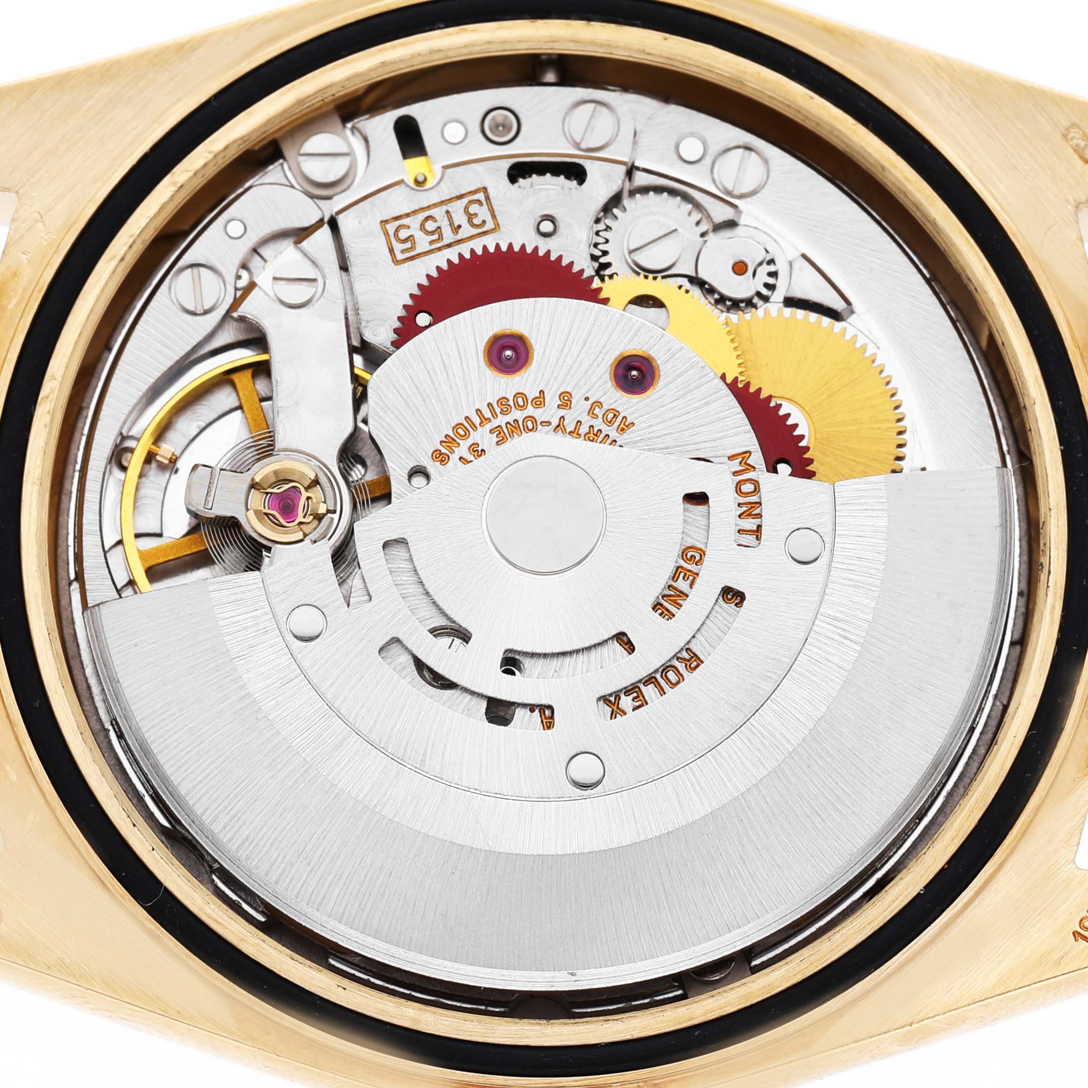 The image shows the movement of a Rolex President 18238 Men's Yellow Gold Champagne Dial watch, viewed from the back, highlighting its intricate mechanical components.