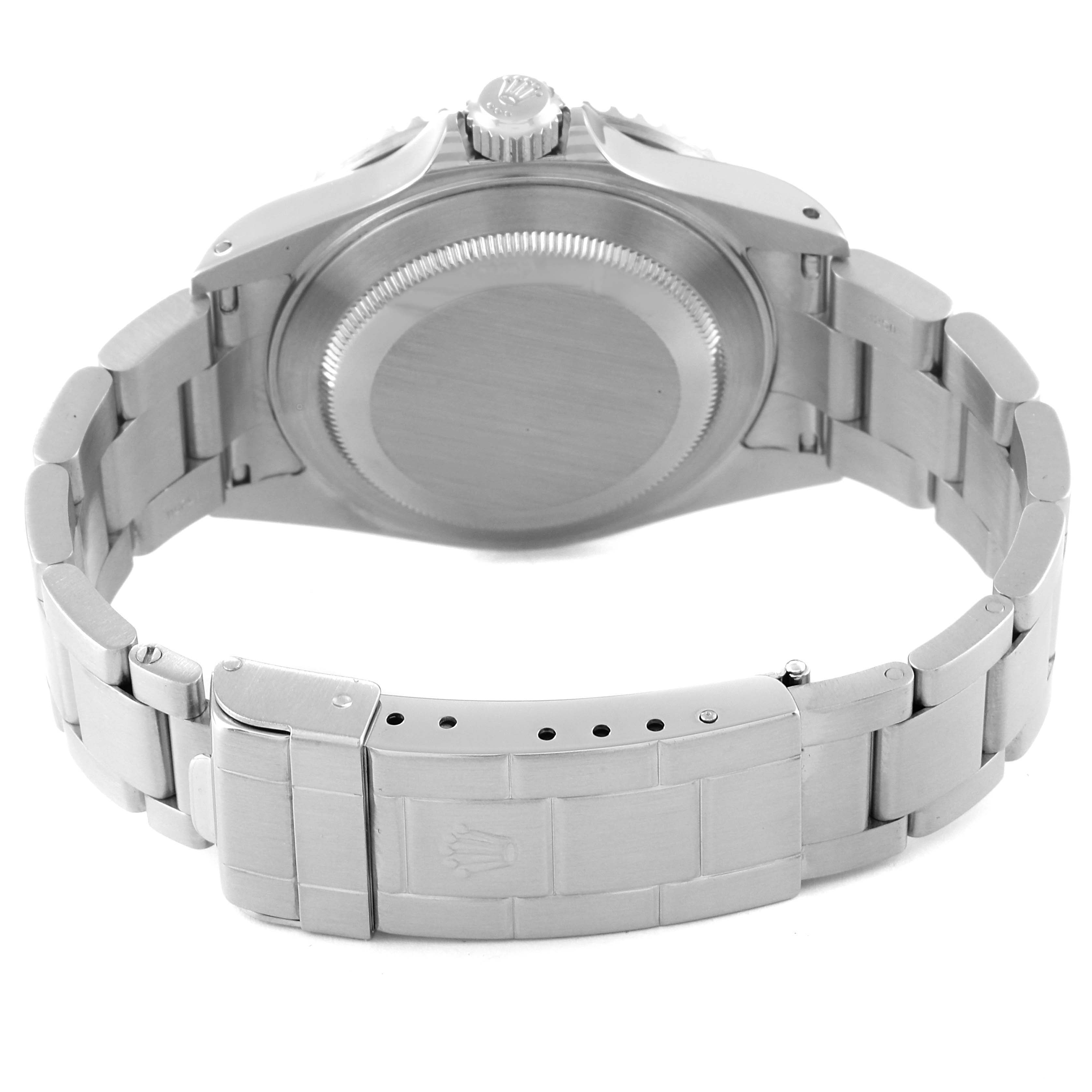 The image shows the backside and clasp of a Rolex Submariner 16610 Men's Stainless Steel Black Dial 16610 Men's Stainless Steel Black Dial watch, highlighting its stainless steel bracelet.