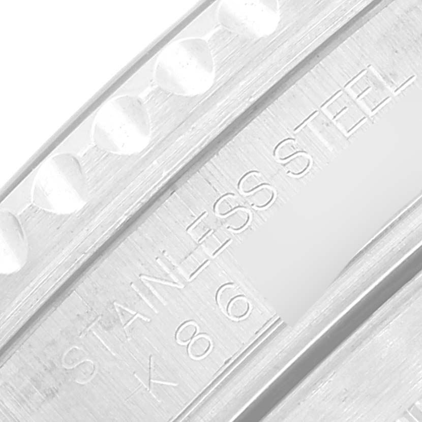 This close-up image shows the stainless steel engraved inner bezel of a Rolex Submariner 16610 Men's Stainless Steel Black Dial 16610 Men's Stainless Steel Black Dial watch.