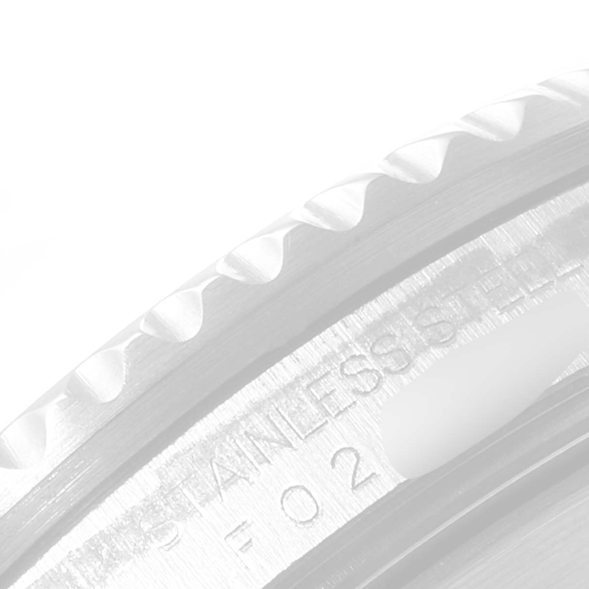 The image shows a close-up of the bezel edge and engravings on a Rolex Submariner 16610LV Men
s Stainless Steel Black Dial 16610LV Men
s Stainless Steel Black Dial watch.