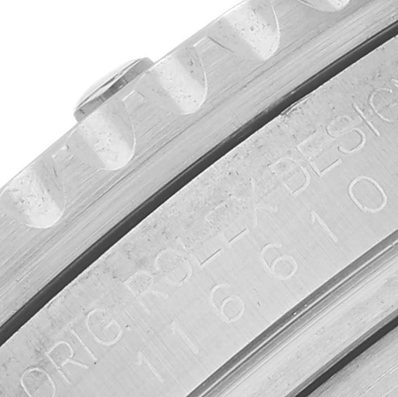 This is a close-up of the engraving on the case back of a Rolex Submariner 116610LV Men's Stainless Steel Green Dial 116610LV Men's Stainless Steel Green Dial watch, displaying part of the model number and design details.