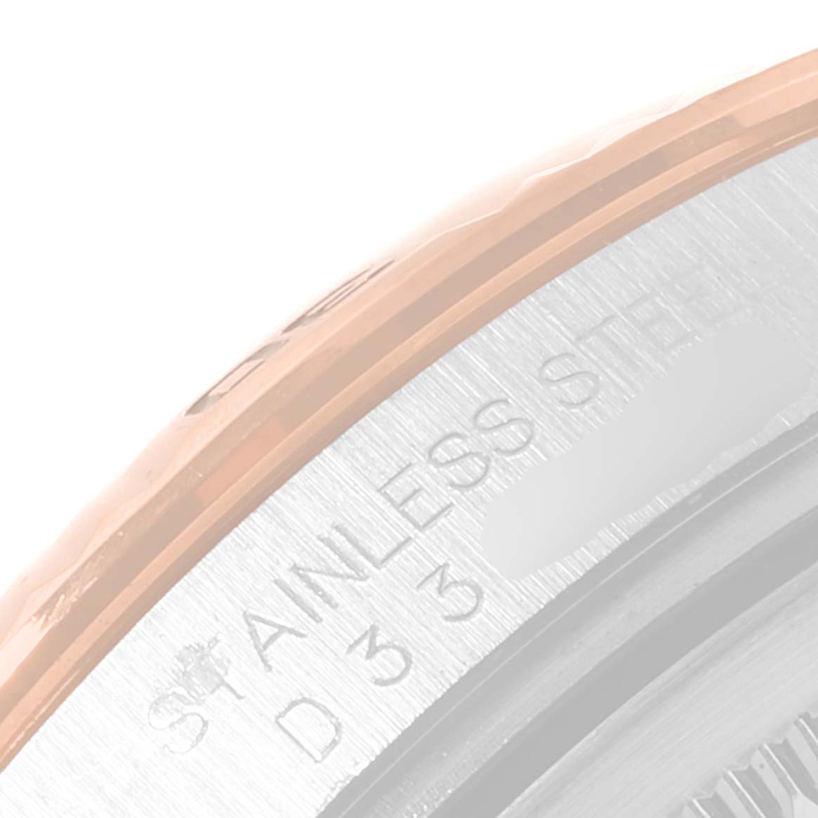 This close-up image shows a partial view of the case back and bezel of a Rolex Turn-o-Graph 116261 Men's Steel and Gold (two tone) White Dial 116261 Men's Steel and Gold (two tone) White Dial watch.