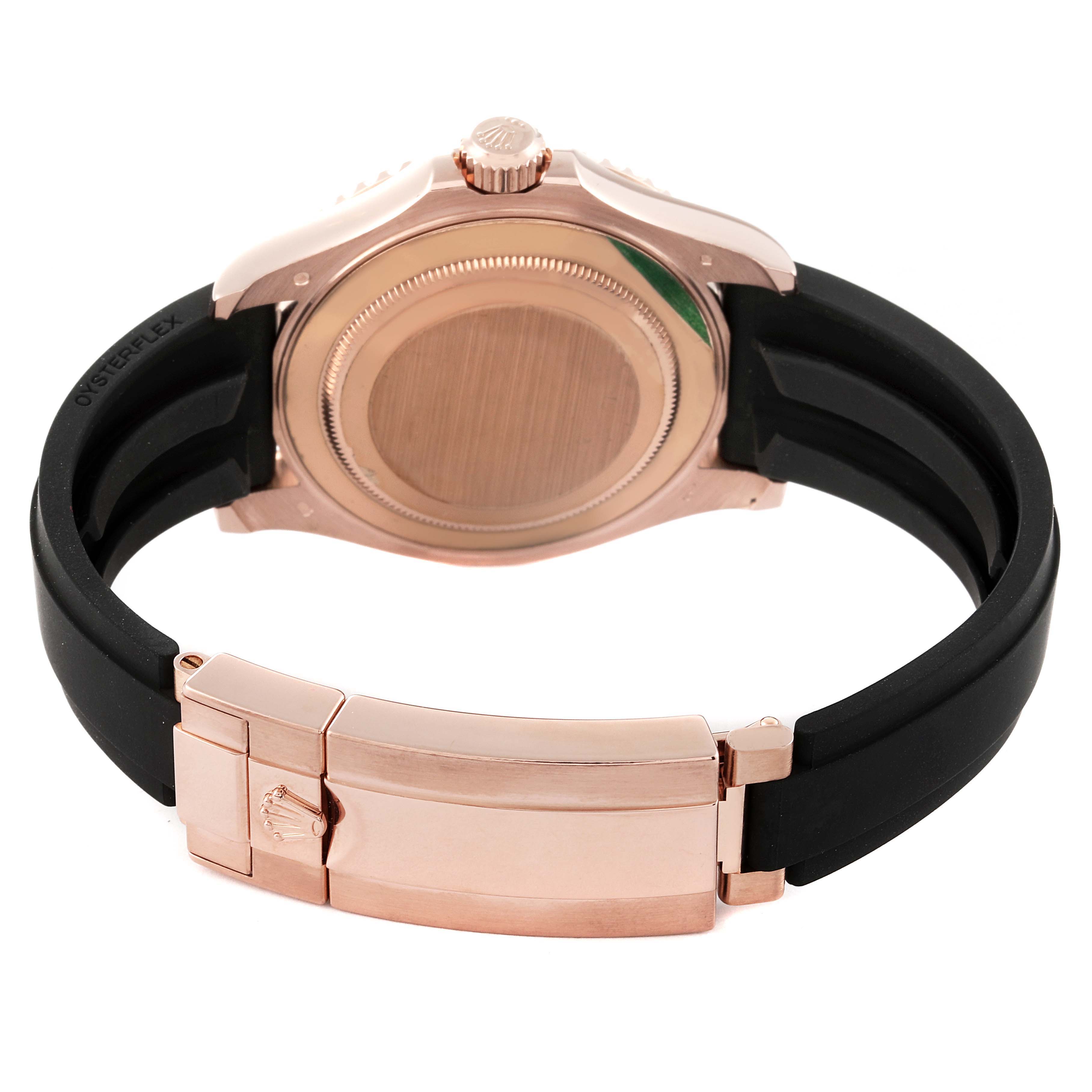 The image shows the back case and clasp of a Rolex Yacht-Master 126655 Men
s Rose Gold Black Dial 126655 Men
s Rose Gold Black Dial watch, featuring a rose gold and black rubber strap.