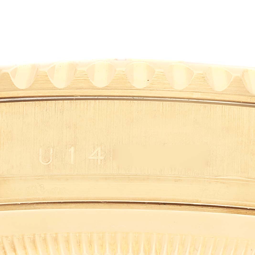 This image shows a close-up of the case side and bezel of the Rolex Yacht-Master 16628 Men's Yellow Gold White Dial 16628 Men's Yellow Gold White Dial watch.