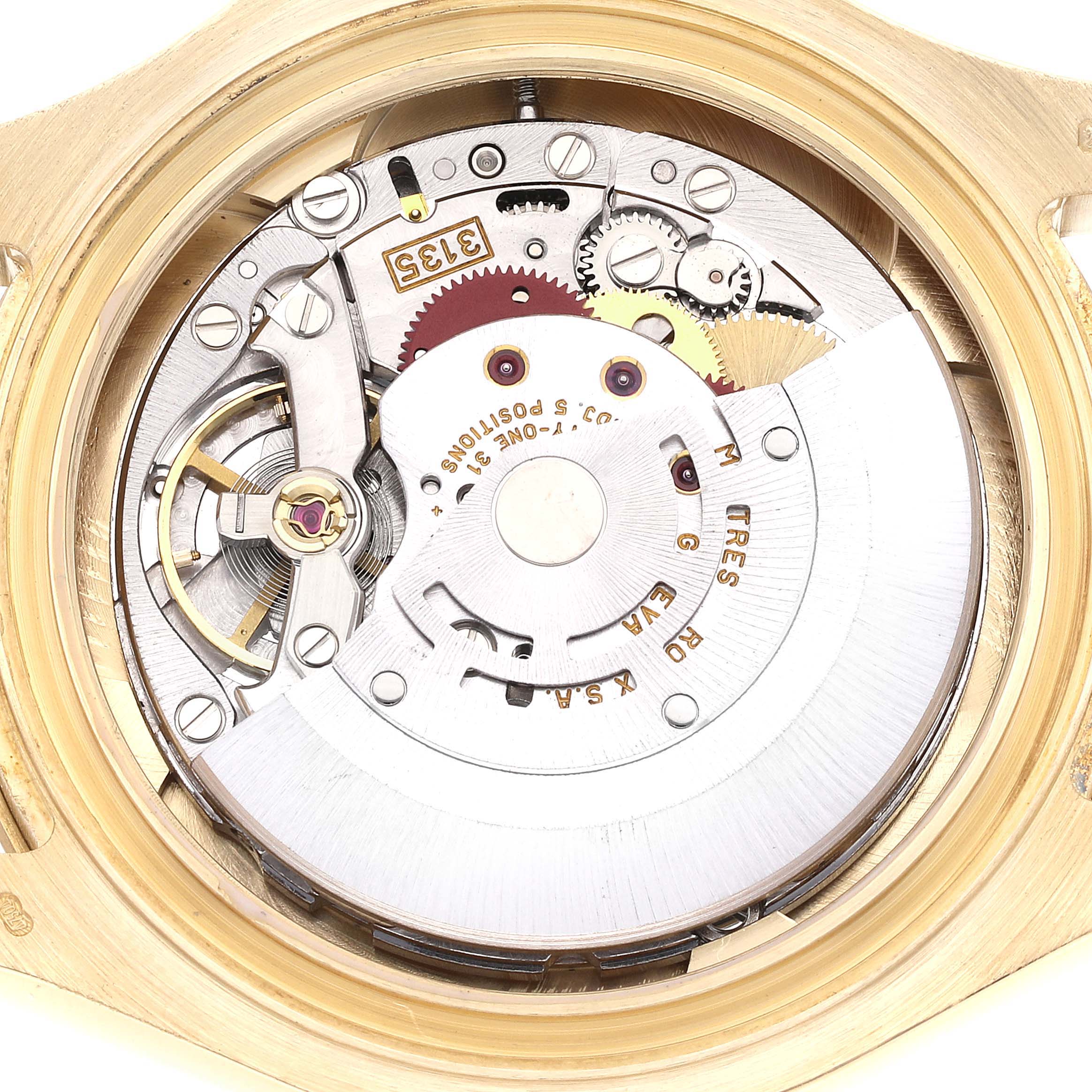 The image shows an internal view of the Rolex Yacht-Master 16628 Men's Yellow Gold White Dial 16628 Men's Yellow Gold White Dial watch mechanism, highlighting its intricate gears and components.