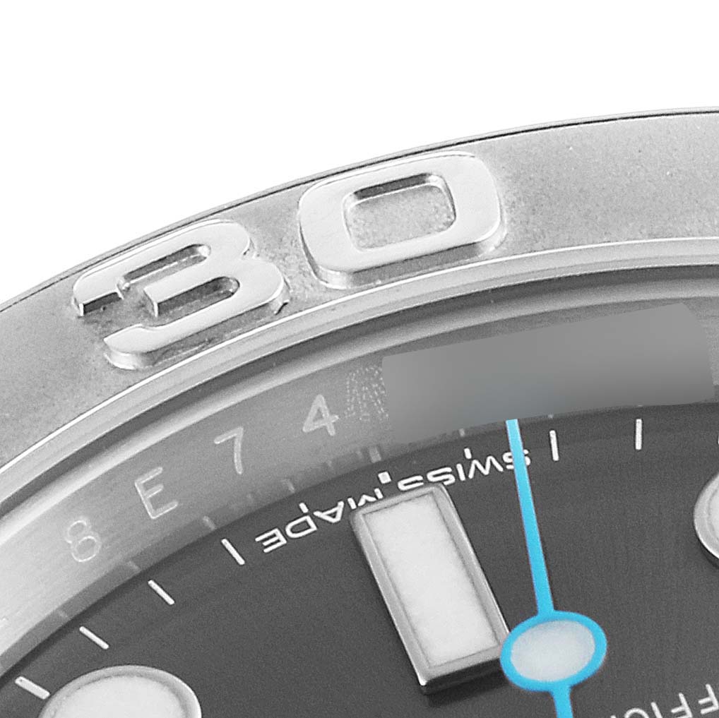 The image shows a close-up of the bezel and a portion of the dial of a Rolex Yacht-Master 116622 Men
s Stainless Steel Grey Dial 116622 Men
s Stainless Steel Grey Dial watch, highlighting the "30" marker and "Swiss made" text.