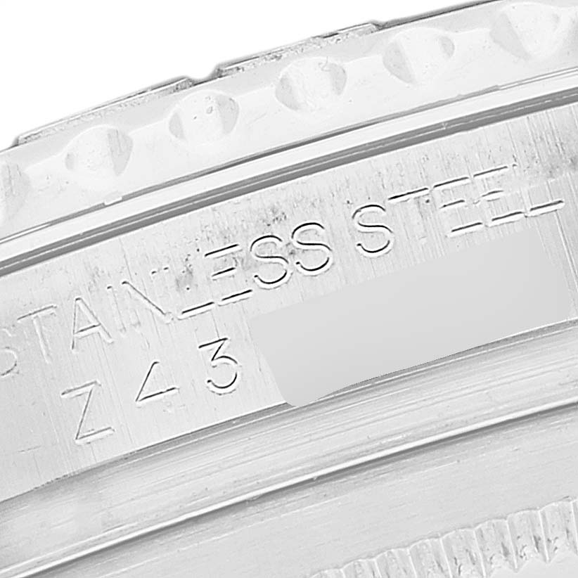 This close-up of a Rolex Yacht-Master 16622 Men's Stainless Steel Silver Dial 16622 Men's Stainless Steel Silver Dial watch shows the engraved text on the stainless steel casing.