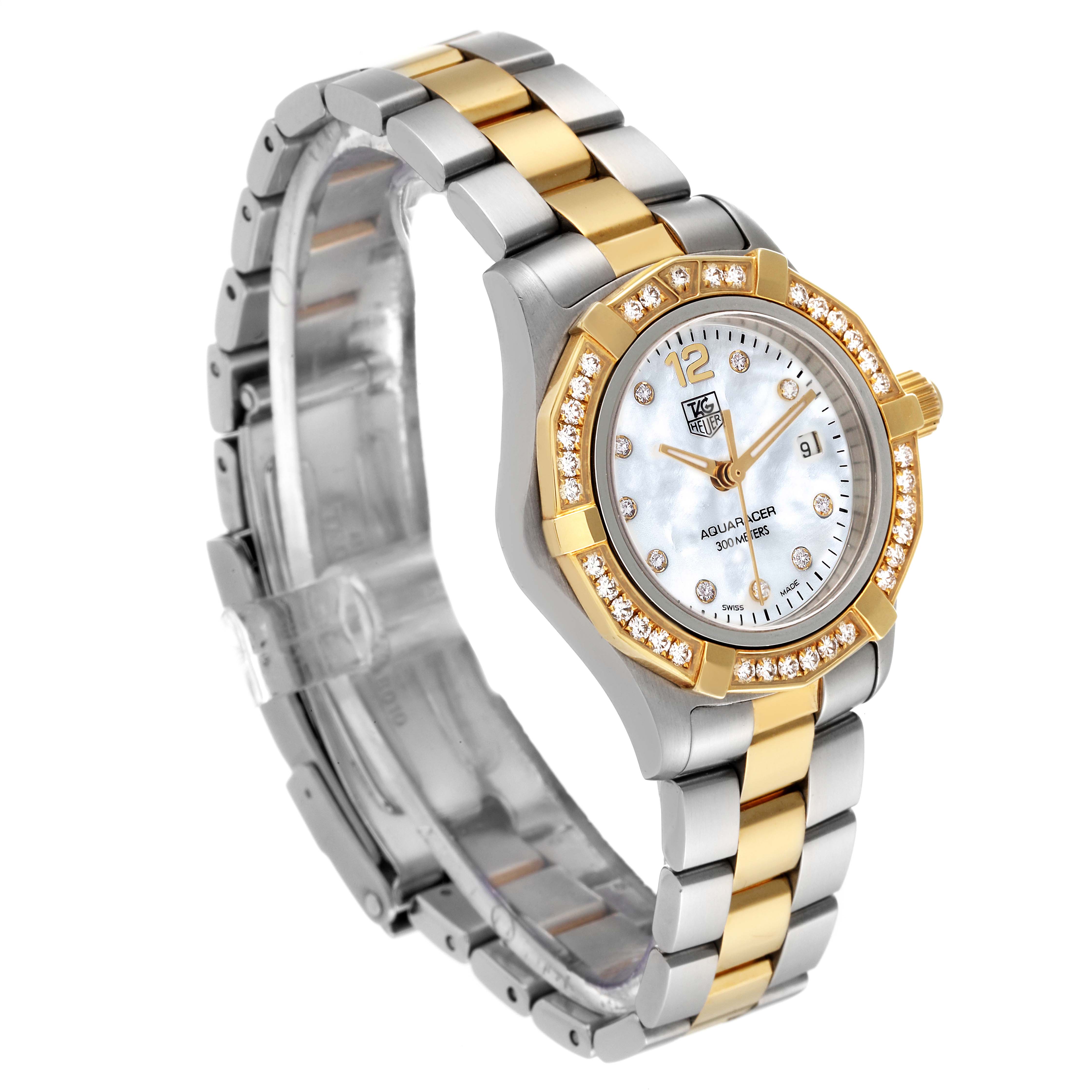 The Tag Heuer Aquaracer WAF1450.BA0825 Women's Steel and Gold (two tone) Mother of Pearl Dial WAF1450.BA0825 Women's Steel and Gold (two tone) Mother of Pearl Dial watch is shown at a three-quarter angle, displaying its bezel, face, crown, and two-tone bracelet.